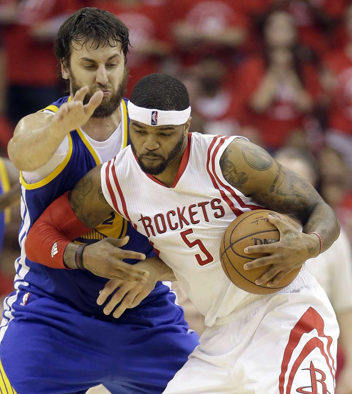 Houston Rockets forward Josh Smith (5) is guarded by Golden State Warriors center Andrew Bogut during the first half in Game 4 of the NBA basketball Western Conference finals Monday, May 25, 2015, in Houston. (AP Photo/David J. Phillip)
