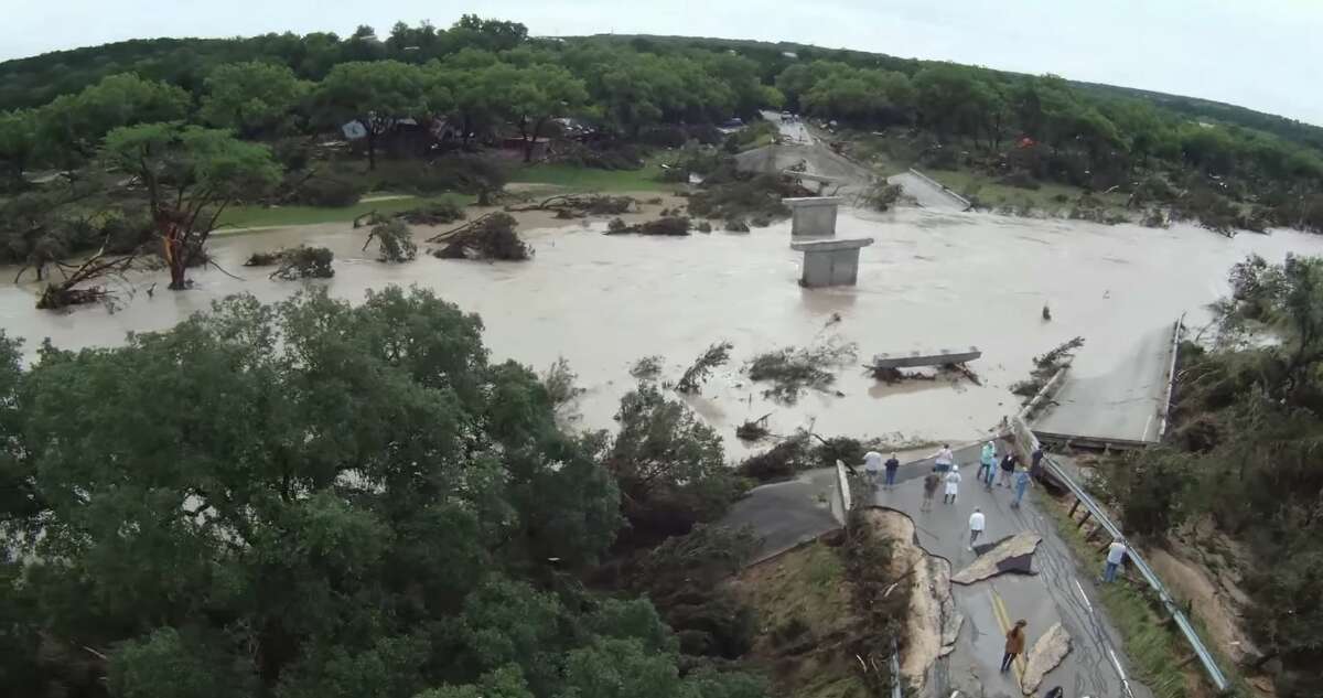 A drone video published to YouTube shows stunning images of a wrecked bridge over the Blanco River destroyed by flooding over the Memorial Day weekend. The bridge — located on Fischer Store Road in Wimberley — failed after water levels rose following more than 12 inches of rainfall on Saturday, according to the video's description.