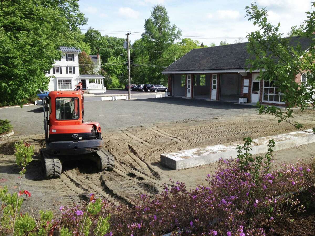 A landscaped park called The Park@ One Green Hill is planned for the long vacant site of a former Texaco gas station in the heart of Washington Depot. May 2015