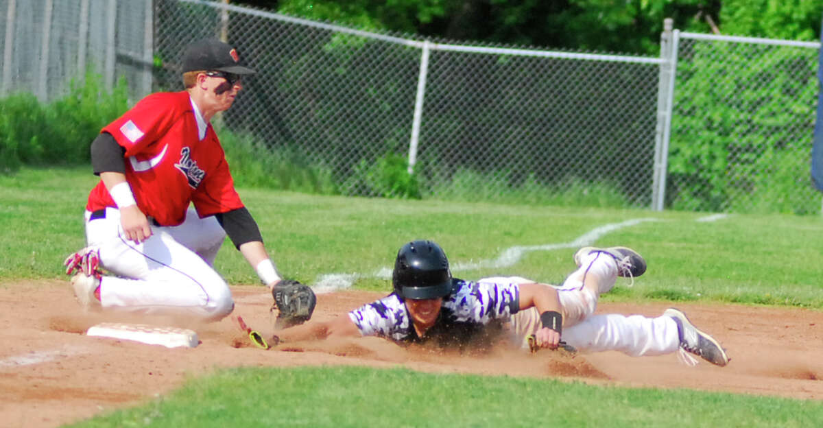Warde third baseman Zach Weinstein, left, tags Staples' Michael Cusa in a game on Tuesday.