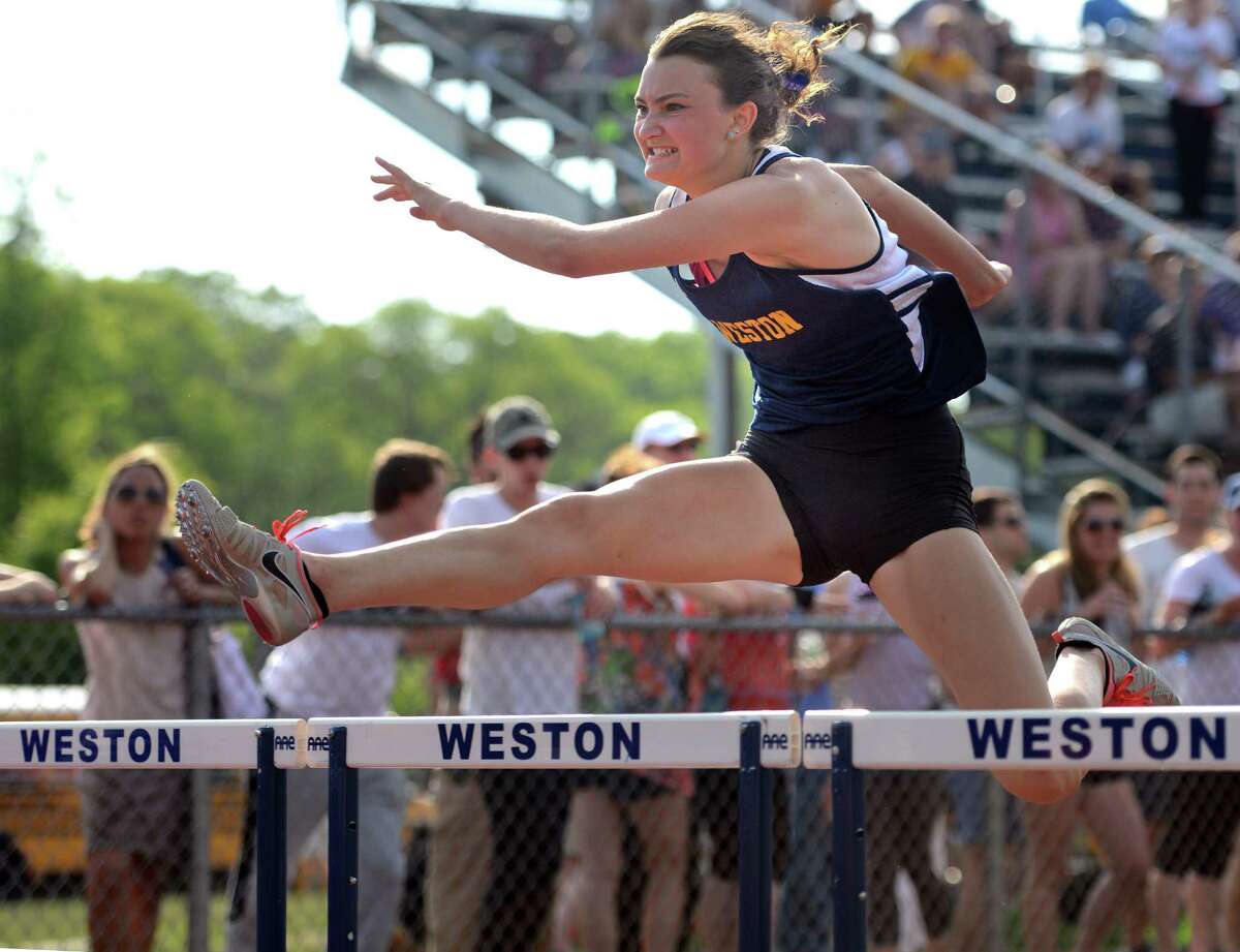 Weston's Nathalie Feingold competes in the 110 meter hurdles during the 2015 SWC Outdoor Track and Field Championship Meet Tuesday, May 26, 2015 at Weston High School.