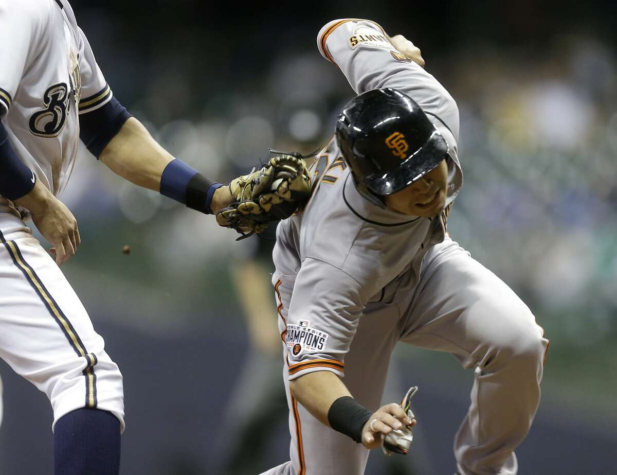 MILWAUKEE, WI - MAY 26: Nori Aoki #23 of the San Francisco Giants gets tagged out by Aramis Ramirez #16 of the Milwaukee Brewers during a run down between second and third base in the ninth inning at Miller Park on May 26, 2015 in Milwaukee, Wisconsin. (Photo by Mike McGinnis/Getty Images)