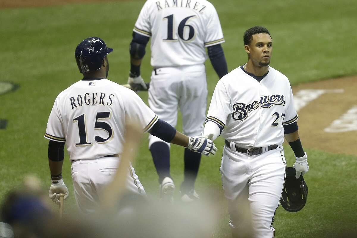 MILWAUKEE, WI - MAY 26: Carlos Gomez #27 of the Milwaukee Brewers celebrates after reaching home plate on a RBI double hit by Ryan Braun in the sixth inning against the San Francisco Giants at Miller Park on May 26, 2015 in Milwaukee, Wisconsin. (Photo by Mike McGinnis/Getty Images)