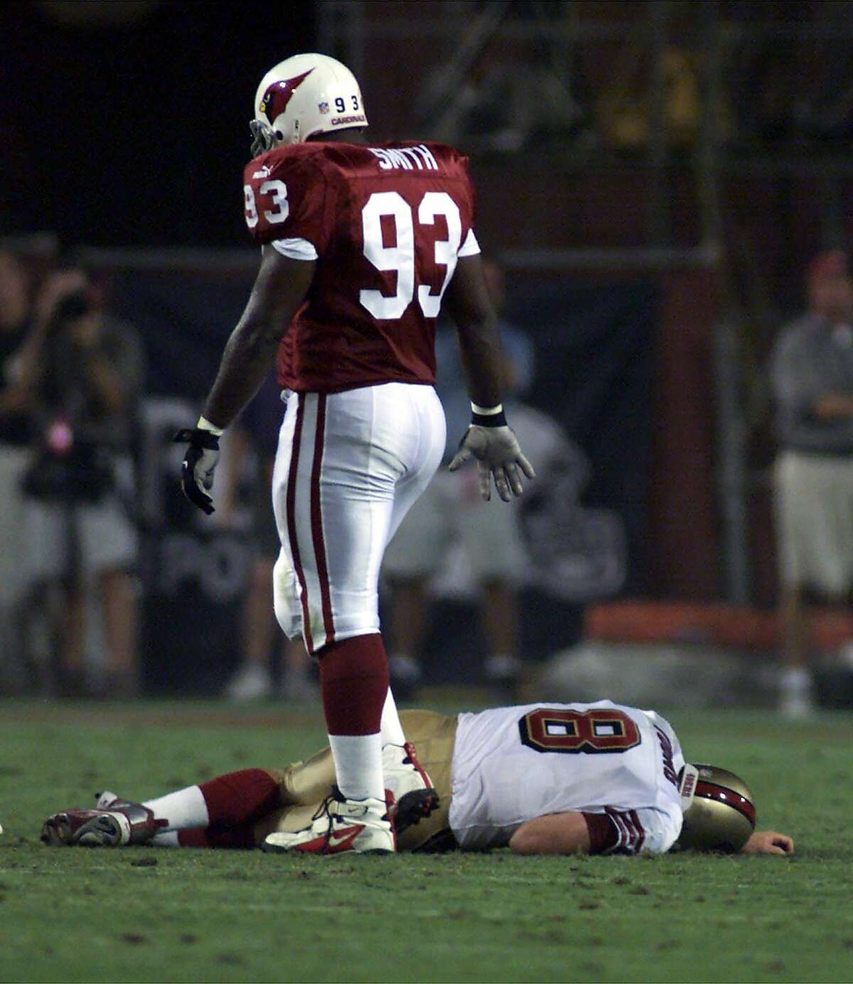 49ERSYOUNG1 -C-27SEP99-SP-MJM Steve Young goes down injured with a concussion, at the end of the 1st half. Arizona Cardinals #93 Mark Smith stood over a motionless Steve Young. CHRONICLE PHOTO BY MICHAEL MALONEY, ALSO RAN 6/13/2000 Ran on: 09-10-2009 Steve Young's career ended after he had a concussion in a game at Arizona.