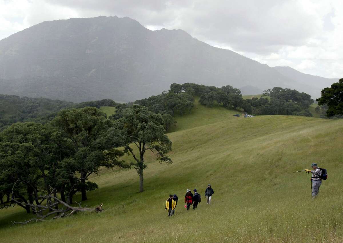 cctrail21_100_pc.jpg One of the trail-building teams hikes through a grassy meadow with Mt. Diablo rising behind them. A workshop on building and maintaining hiking trails at Chaparral Spring near Mt. Diablo on 4/17/04 in Clayton. PAUL CHINN/The Chronicle MANDATORY CREDIT FOR PHOTOG AND S.F. CHRONICLE/NO SALES - MAGS OUT ProductNameChronicle A trail-building team hikes through a grassy meadow in the shadow of Mount Diablo. The need for trail design and repair has grown along with the size of the park, which now covers 85,000 acres. ProductNameArticle_Nameebltrail28.ART A trail-building team hikes through a grassy meadow in the shadow of Mount Diablo. The need for trail design and repair has grown along with the size of the park, which now covers 85,000 acres.