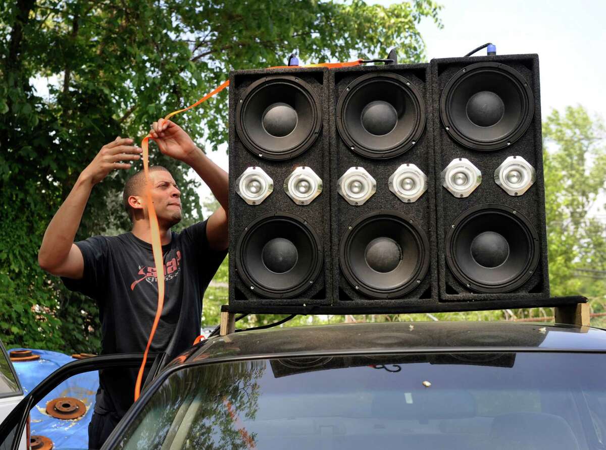 Guillermo Encarnacion, 21, of Danbury, Conn. a mechanic at Brothers Auto Sale in Danbury rigged up a powerful sound system in his brothers car with speakers on the roof as well as the back seat, trunk and other places. Photo Wednesday, May 27, 2015.