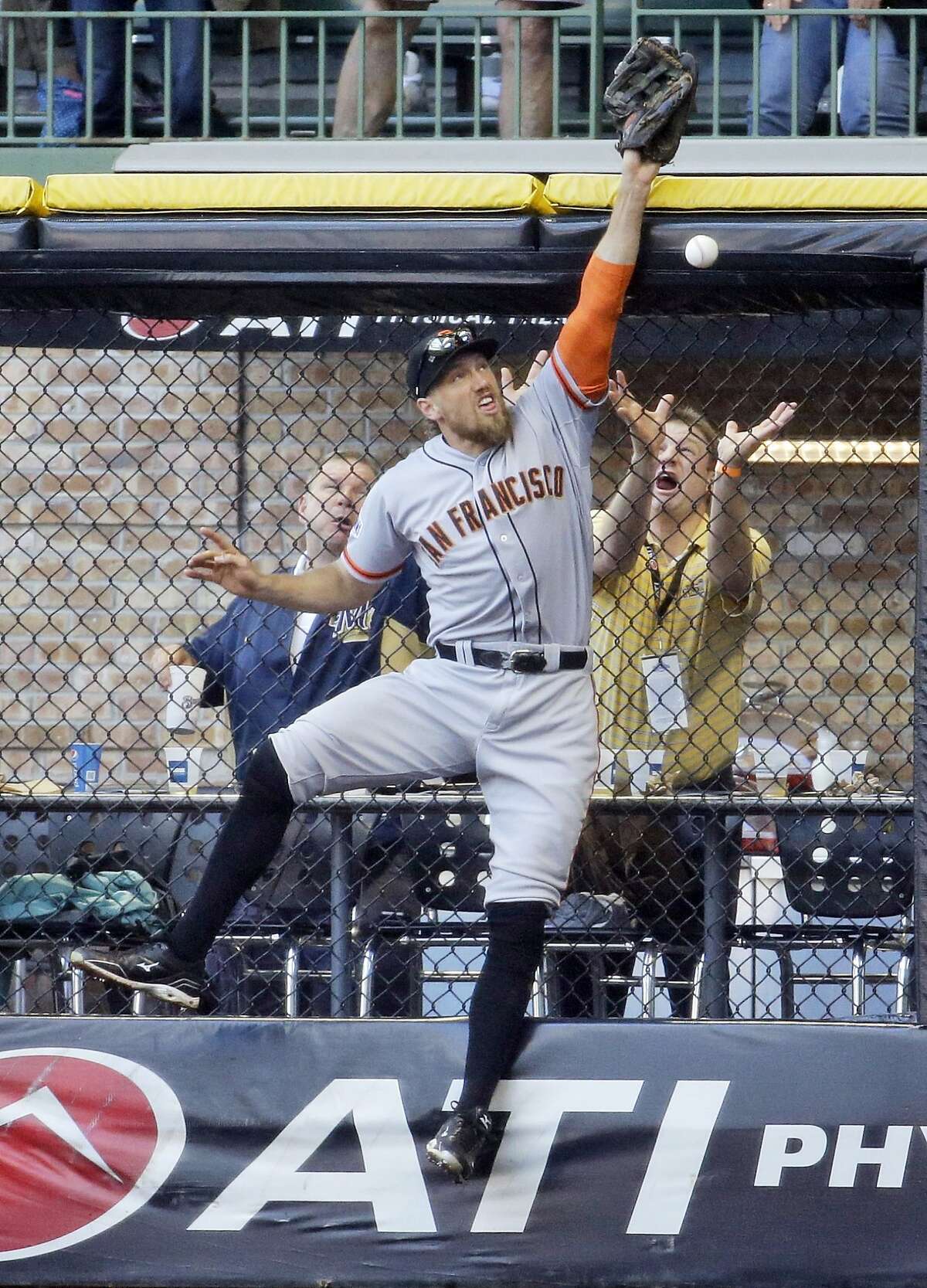 San Francisco Giants right fielder Hunter Pence can't catch a ball hit by Milwaukee Brewers' Khris Davis during the fourth inning of a baseball game Wednesday, May 27, 2015, in Milwaukee. (AP Photo/Morry Gash)