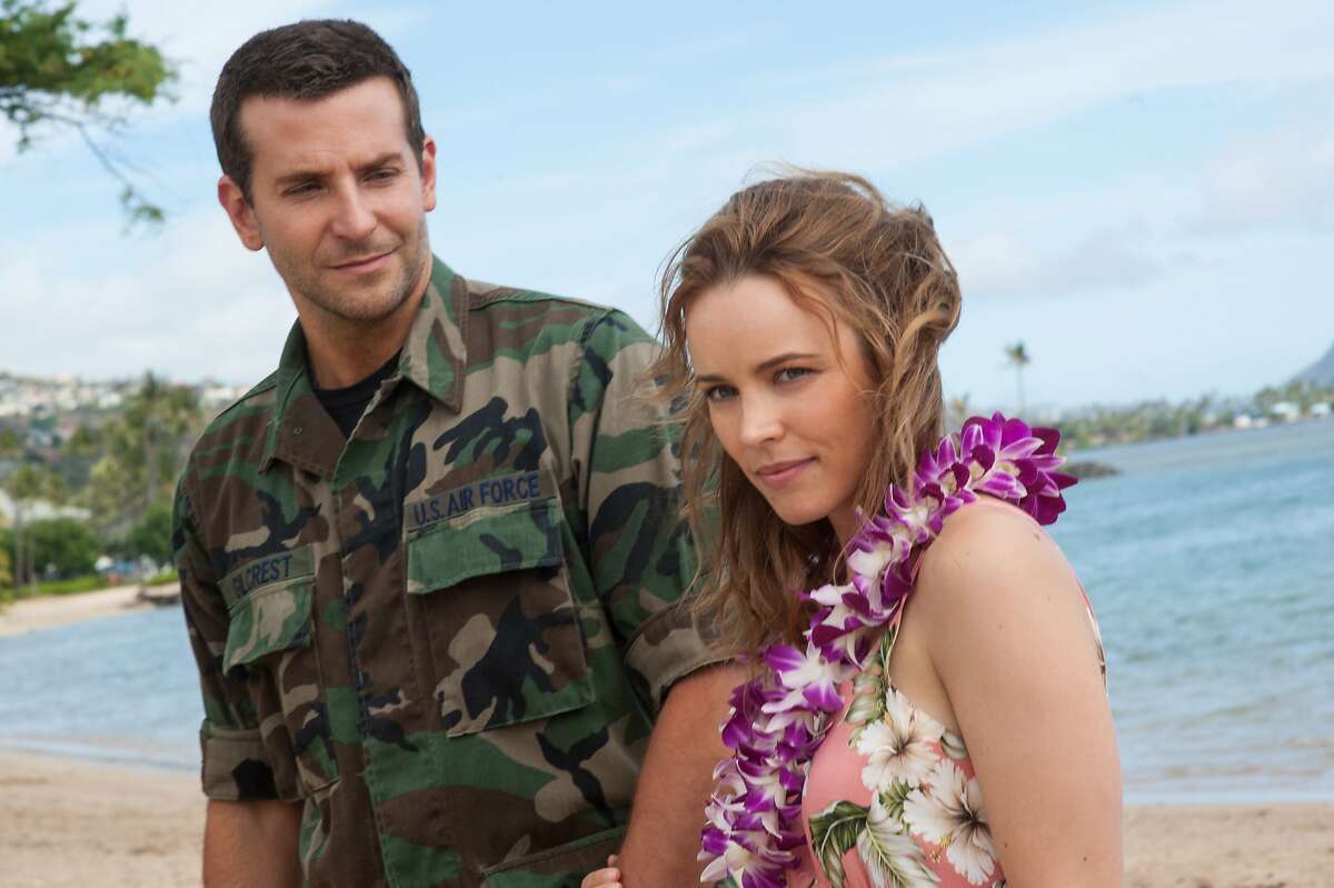 This photo provided by Sony Pictures Entertainment shows Bradley Cooper, left, and Rachel McAdams in a scene from Columbia Pictures' "Aloha." The movie releases in U.S. theaters on May 29, 2015. (Neal Preston/Sony Pictures Entertainment via AP)