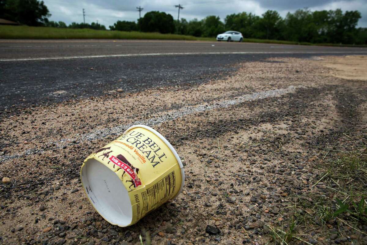 Is this any way to treat a legend? A container for Blue Bell homemade vanilla ice cream litters the side of Texas State Highway 105 in Brenham.