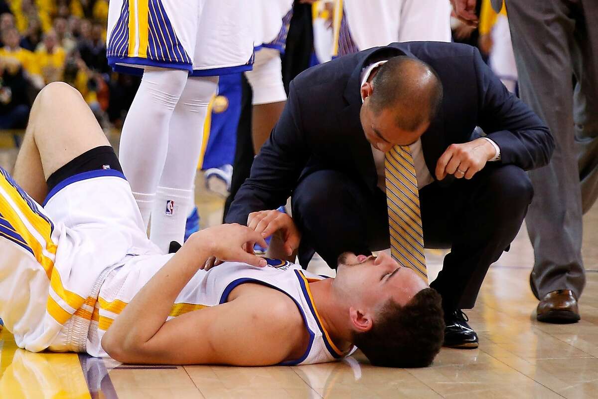 OAKLAND, CA - MAY 27: Klay Thompson #11 of the Golden State Warriors is injured in the fourth quarter against the Houston Rockets during game five of the Western Conference Finals of the 2015 NBA Playoffs at ORACLE Arena on May 27, 2015 in Oakland, California. NOTE TO USER: User expressly acknowledges and agrees that, by downloading and or using this photograph, user is consenting to the terms and conditions of Getty Images License Agreement. (Photo by Ezra Shaw/Getty Images)