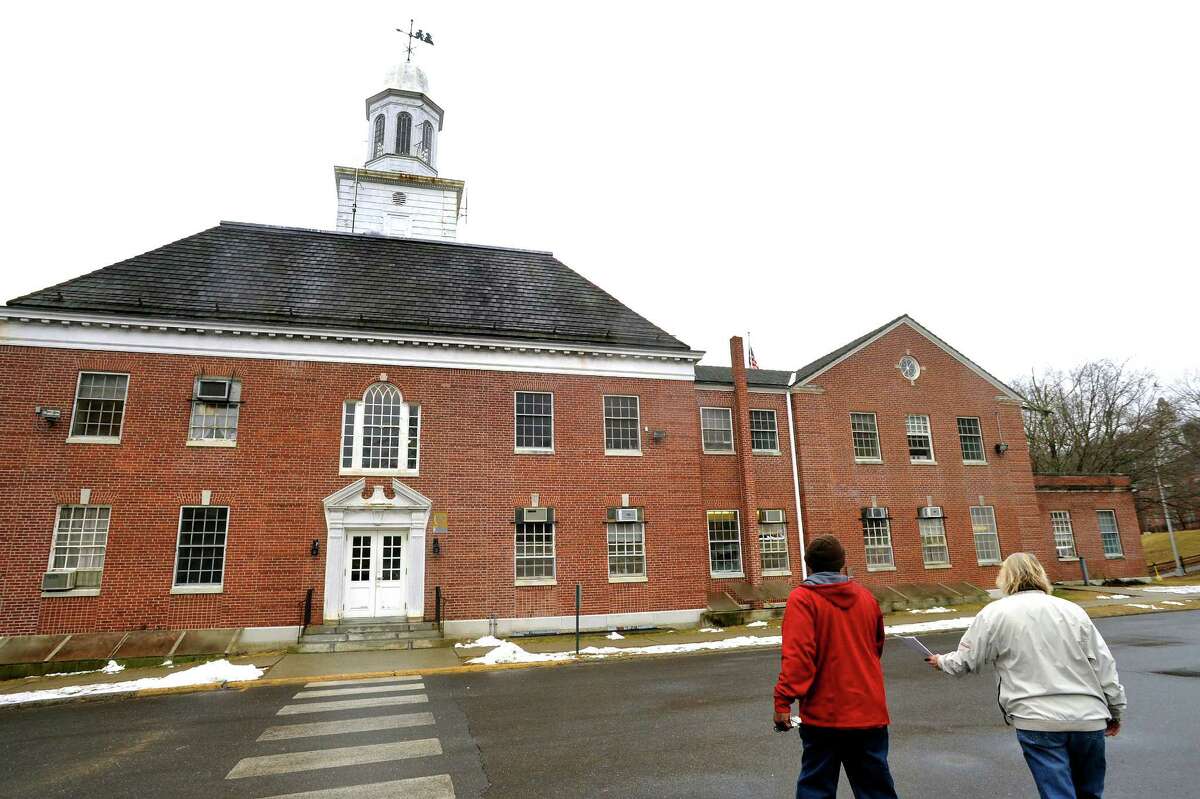 Workers enter Lenore Davidson Building at Southbury Training School.