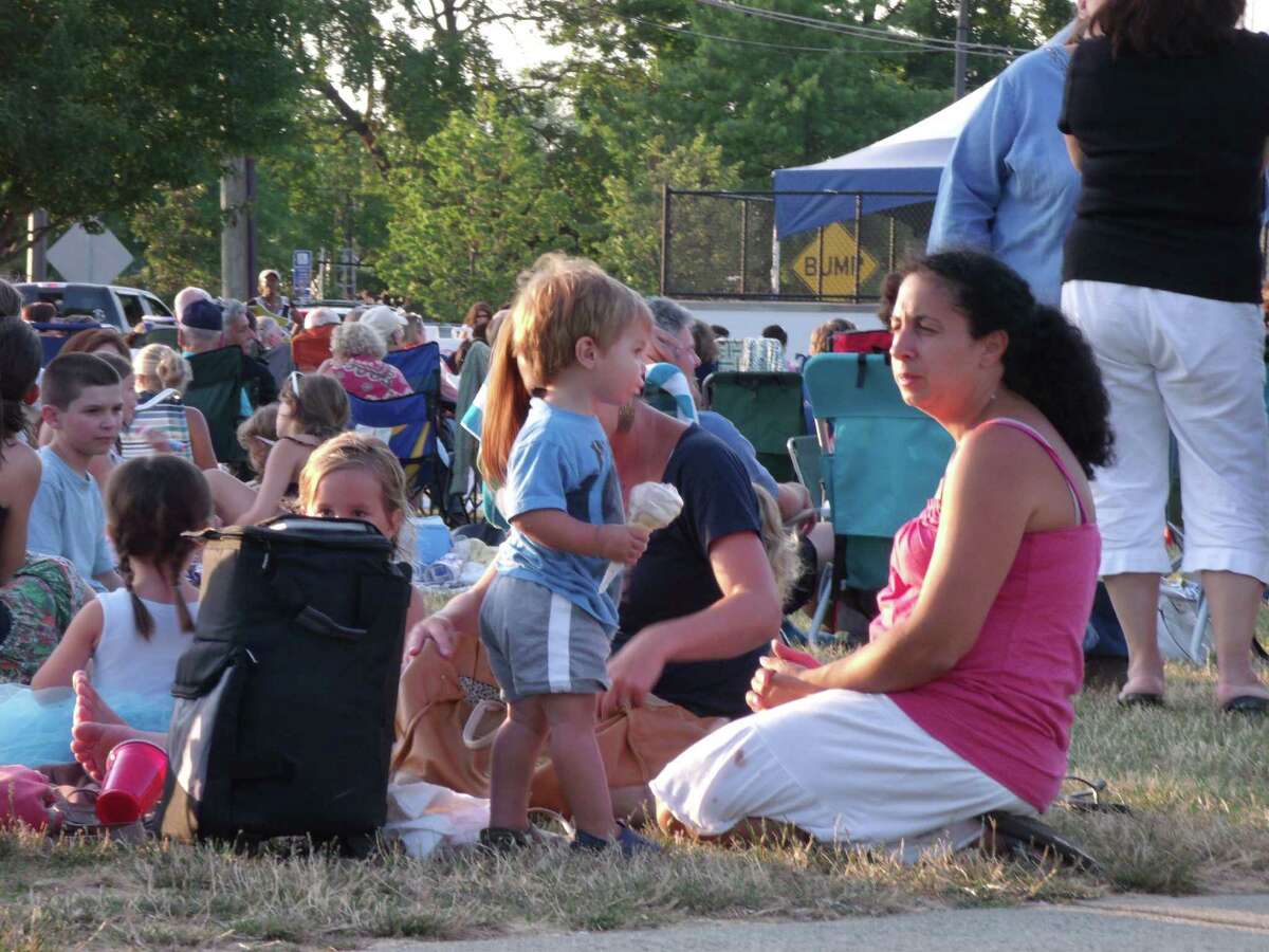 Concert-goers enjoy the sounds of the Beatles with tribute band "Ticket To Ride" at the City of Norwalk Recreation and Parks Summer Concert Series Sponsored by First County Bank brings music to Calf Pasture Beach.