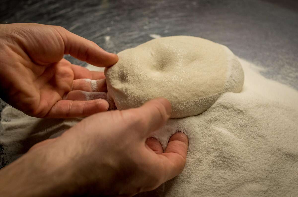 Alessandro Delle Rose rolls dough in rice flour at Montesacro in San Francisco, Calif., on May 27th, 2015.