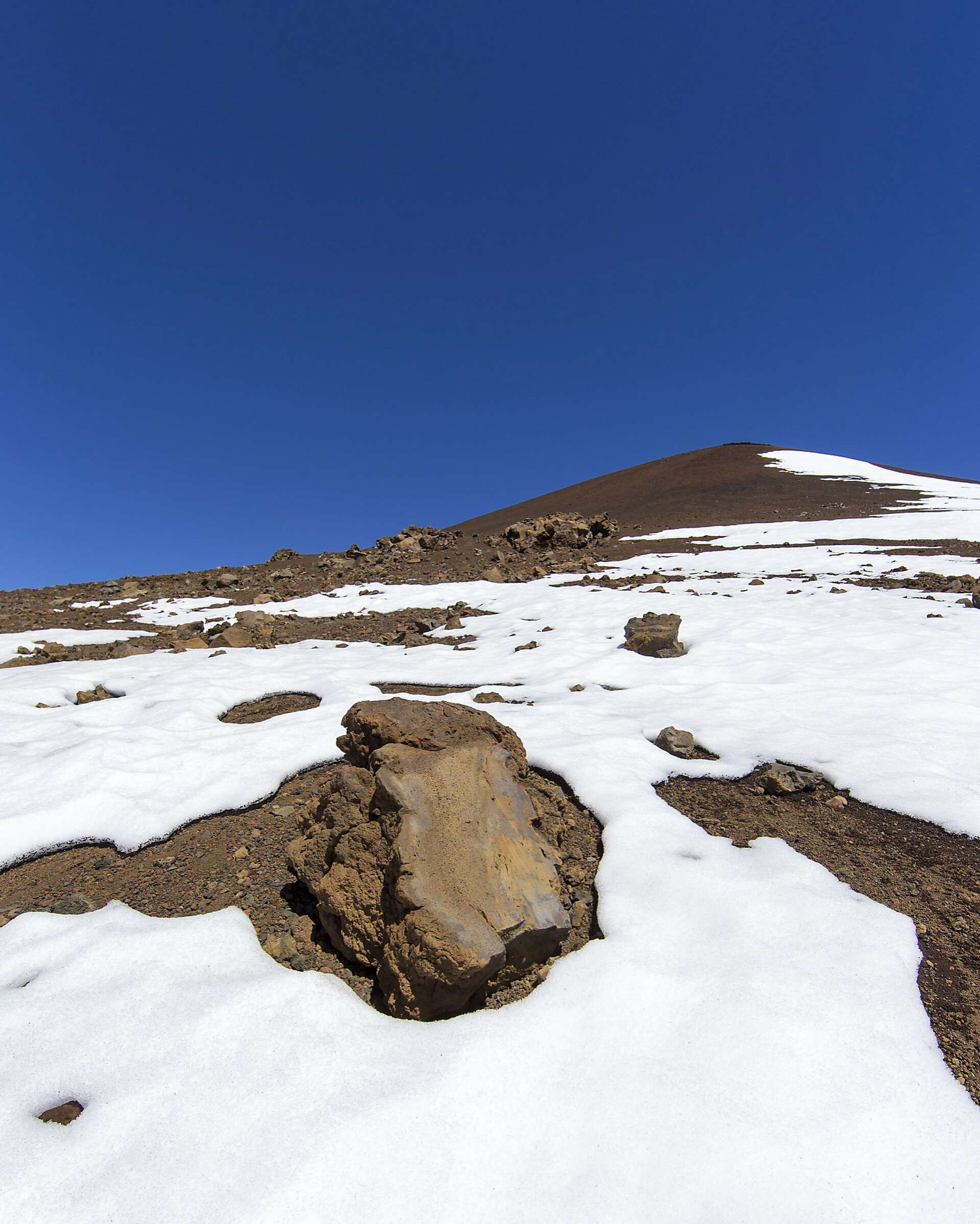 Snow blankets Mauna Kea and Mauna Loa on the Big Island of Hawaii