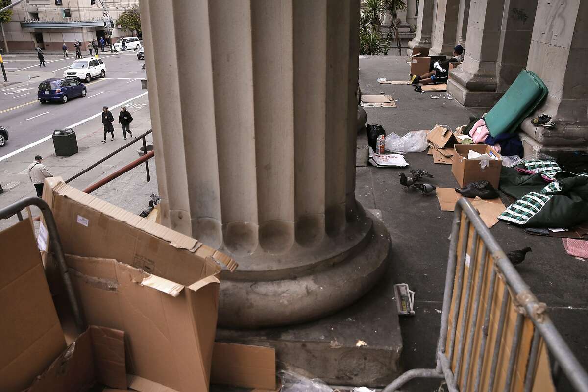 The homeless have set up living on the steps of the old United States Mint building on Mission St. as seen on Thurs. May, 28, 2015, San Francisco, Calif. San Francisco, which thinks it is a world class city measures up against cities like New York and London but has problems it ignores, like street beggars, dirty streets and trash.
