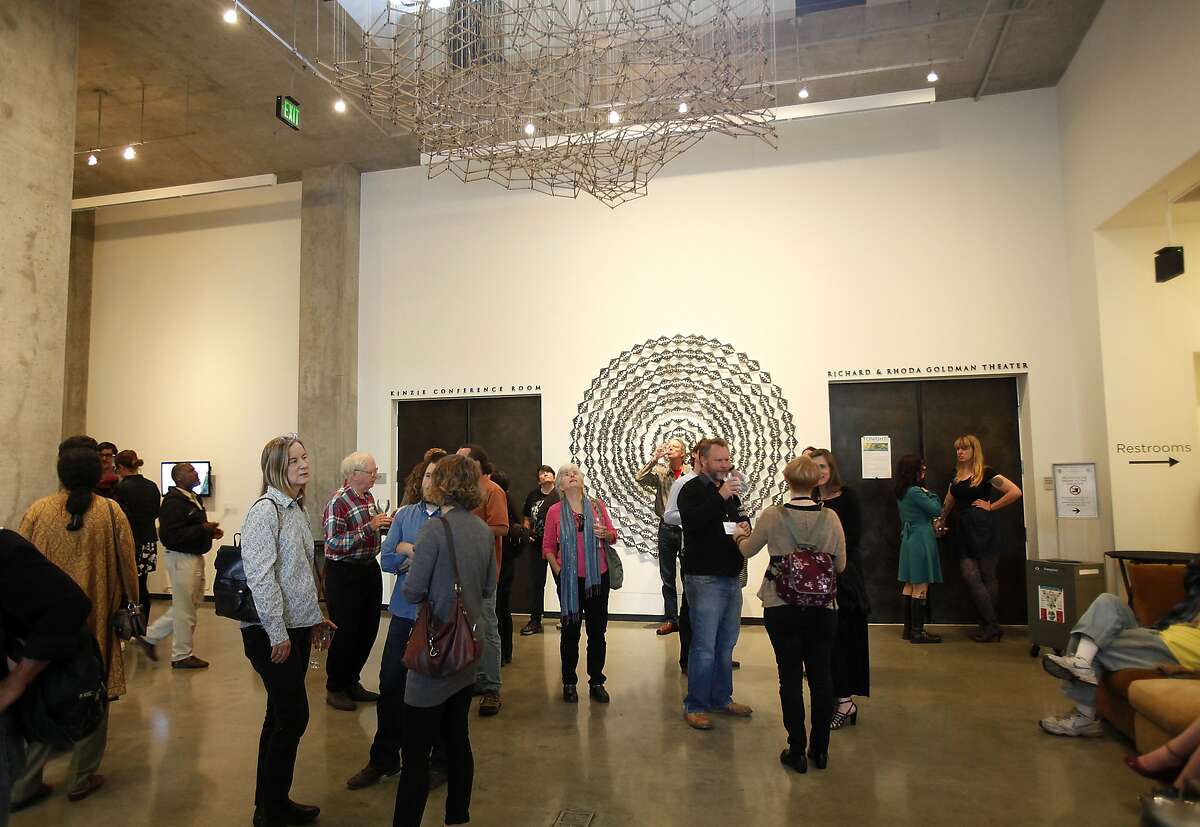 Guests at the opening reception for Security Question, an art show at the David Brower Center in Berkeley, Calif., on Thursday, May 28, 2015.