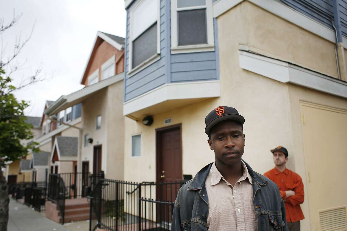 Masterminds behind The Last Black man in San Francisco Jimmie Fails, co-writer and actor, and Joe Talbot, co-writer and director, stand in the Army Street projects in the Mission where Fails grew up.