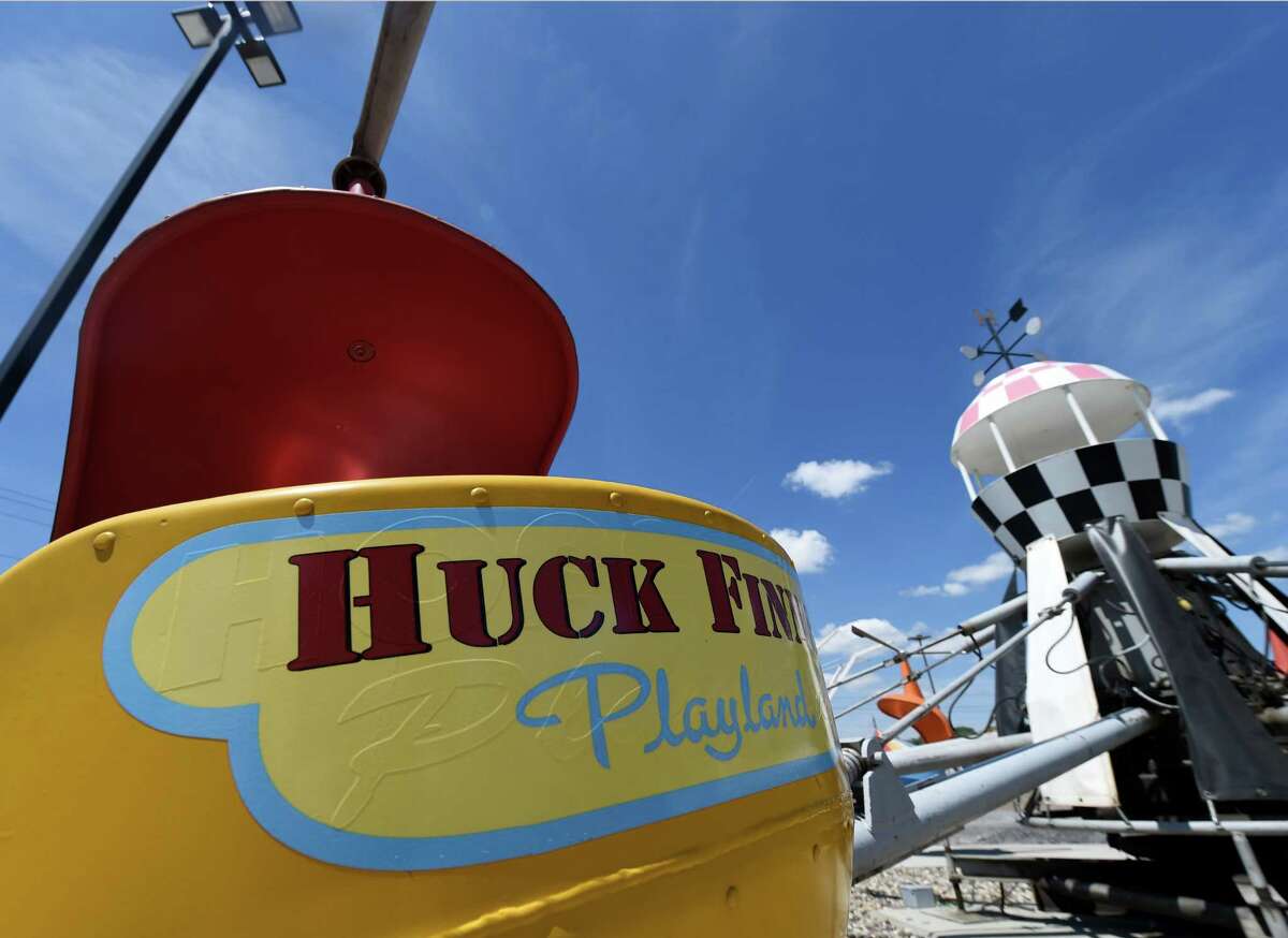 A renovated helicopter ride with the new logo sits ready and waiting for a few young pilots at the Huck Finn's Playland as work continues on the site north of Huck Finn's Warehouse Friday afternoon May 29, 2015 in Albany, N.Y. The Playland will remain as Huck Finn's Warehouse undergoes redevelopment. (Skip Dickstein/Times Union)