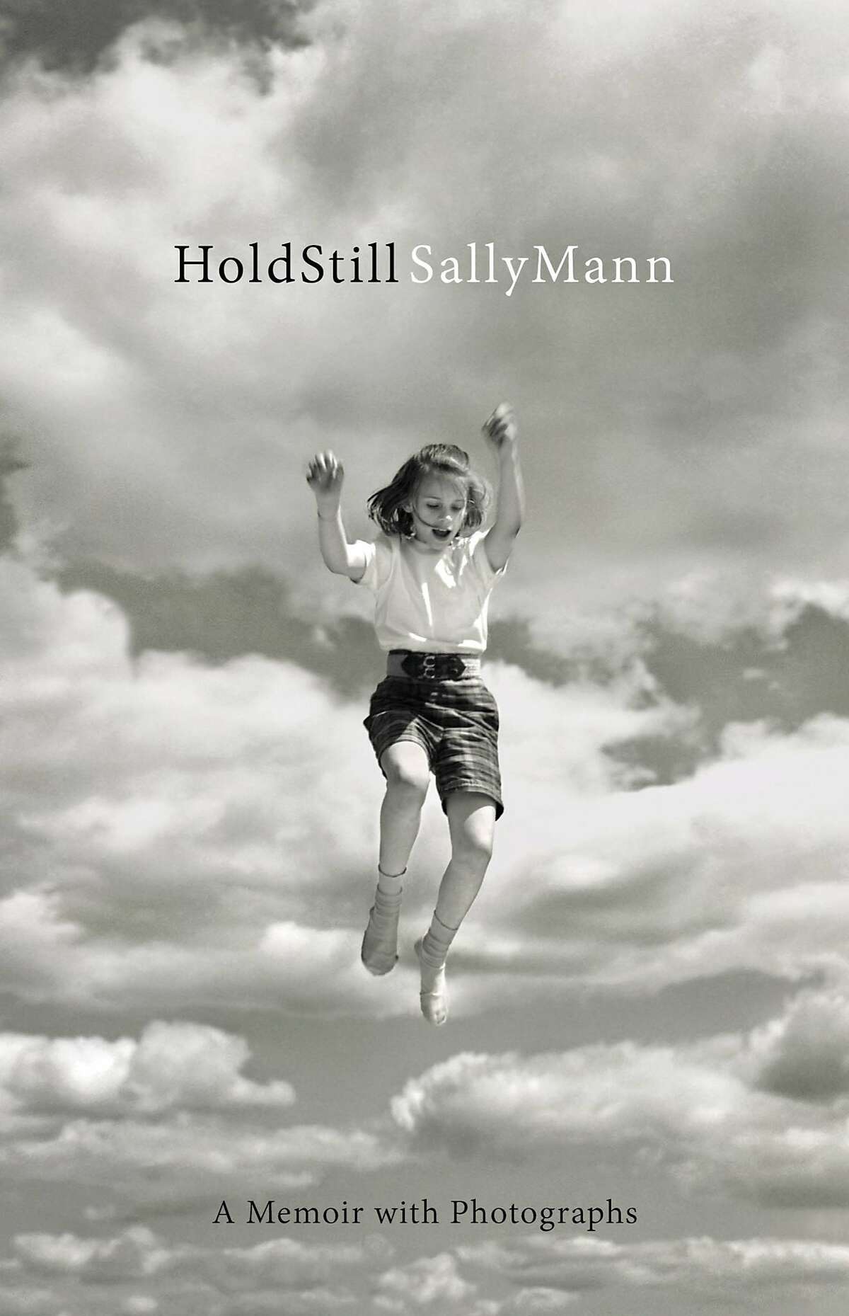 This book cover image released by Little, Brown and Co. shows "Hold Still," by Sally Mann. (Little, Brown and Co. via AP) AP PROVIDES ACCESS TO THIS HANDOUT PHOTO TO BE USED SOLELY TO ILLUSTRATE NEWS REPORTING OR COMMENTARY ON THE FACTS OR EVENTS DEPICTED IN THIS IMAGE. THIS IMAGE MAY ONLY BE USED FOR 14 DAYS FROM TIME OF TRANSMISSION; NO ARCHIVING; NO LICENSING.