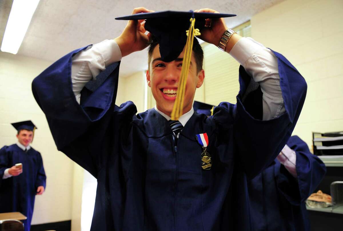 Notre Dame of Fairfield's Class of 2015 Commencement Exercises in Fairfield, Conn., on Friday May 29, 2015. Graduate Nick Carlotto gets ready.