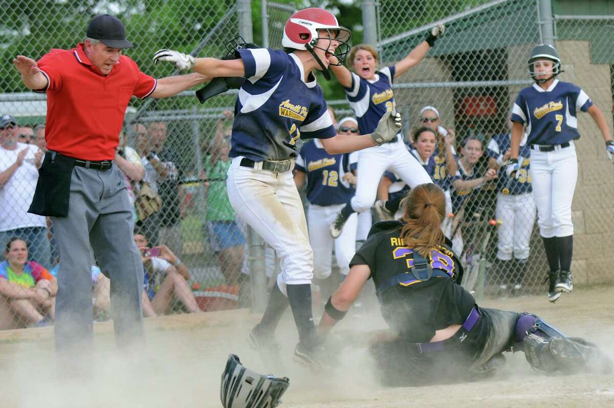 Averill Park's Torey Chenette, center, jumps for joy when she slides home under the tag to win 3-2 over Troy in the Class A softball final on Friday, May 29, 2015, at Clifton Common in Clifton Park, N.Y. (Cindy Schultz / Times Union)