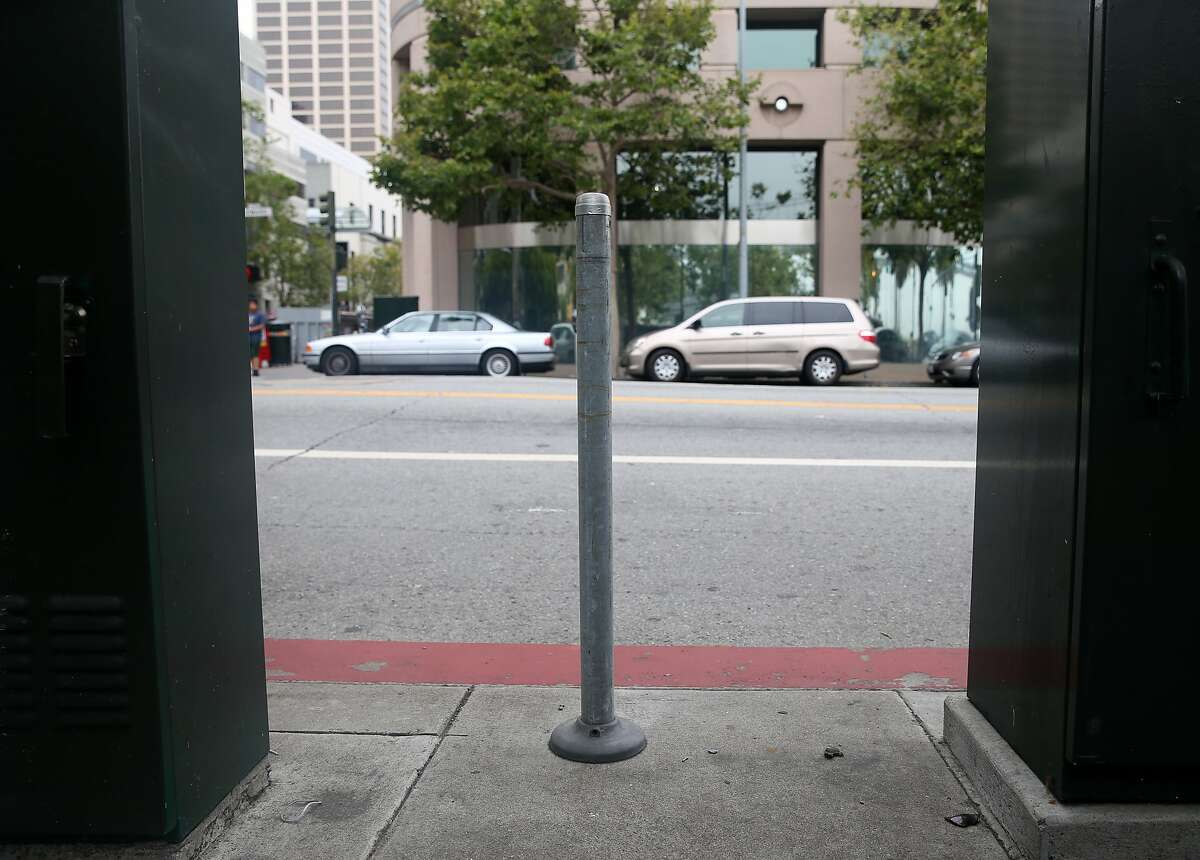 Only the posts remain on a short block of Howard Street between The Embarcadero and Steuart Street in San Francisco, Calif. on Saturday, May 30, 2015 where parking meters once collected cash. The city is pulling out over 1,700 parking spaces to make room for various street improvements.