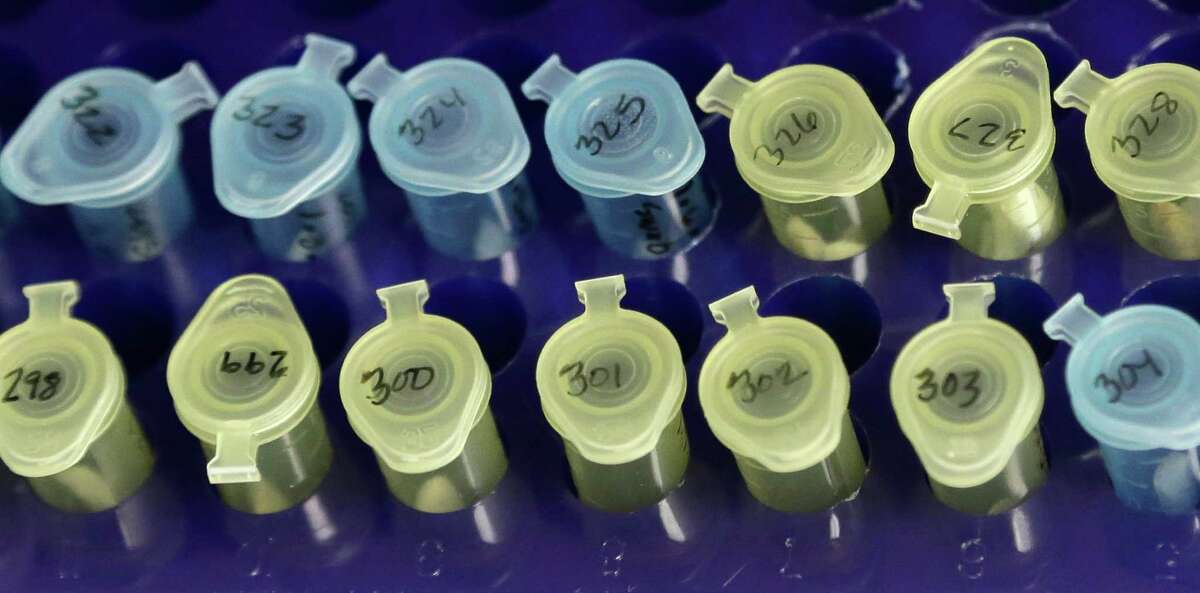 Vials of evidence in a sexual assault case are labeled and sorted in the biology lab at the Houston Forensic Science Center in Houston on Thursday, April 2, 2015. In some cases, it's simply too late for justice because statutes of limitations have expired. In others, investigators may have to wade through old, often incomplete, police files, search for witnesses and suspects, confront fading memories and persuade survivors to reopen painful chapters of their lives. (AP Photo/Pat Sullivan)