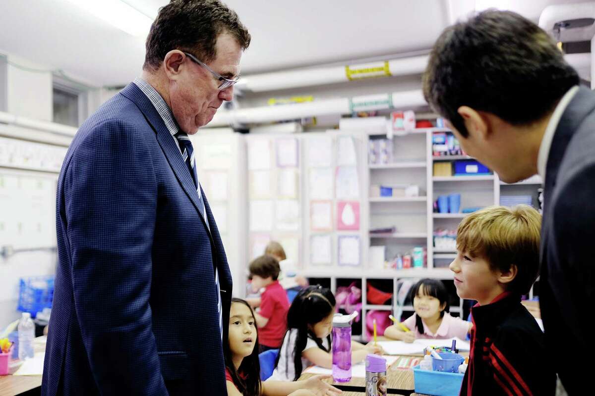 HISD Superintendent Terry Grier talked with a student during a May 2015 visit to the Mandarin Chinese Immersion School, one of the newest magnet schools in the district. Applications far exceeded available seats last year.