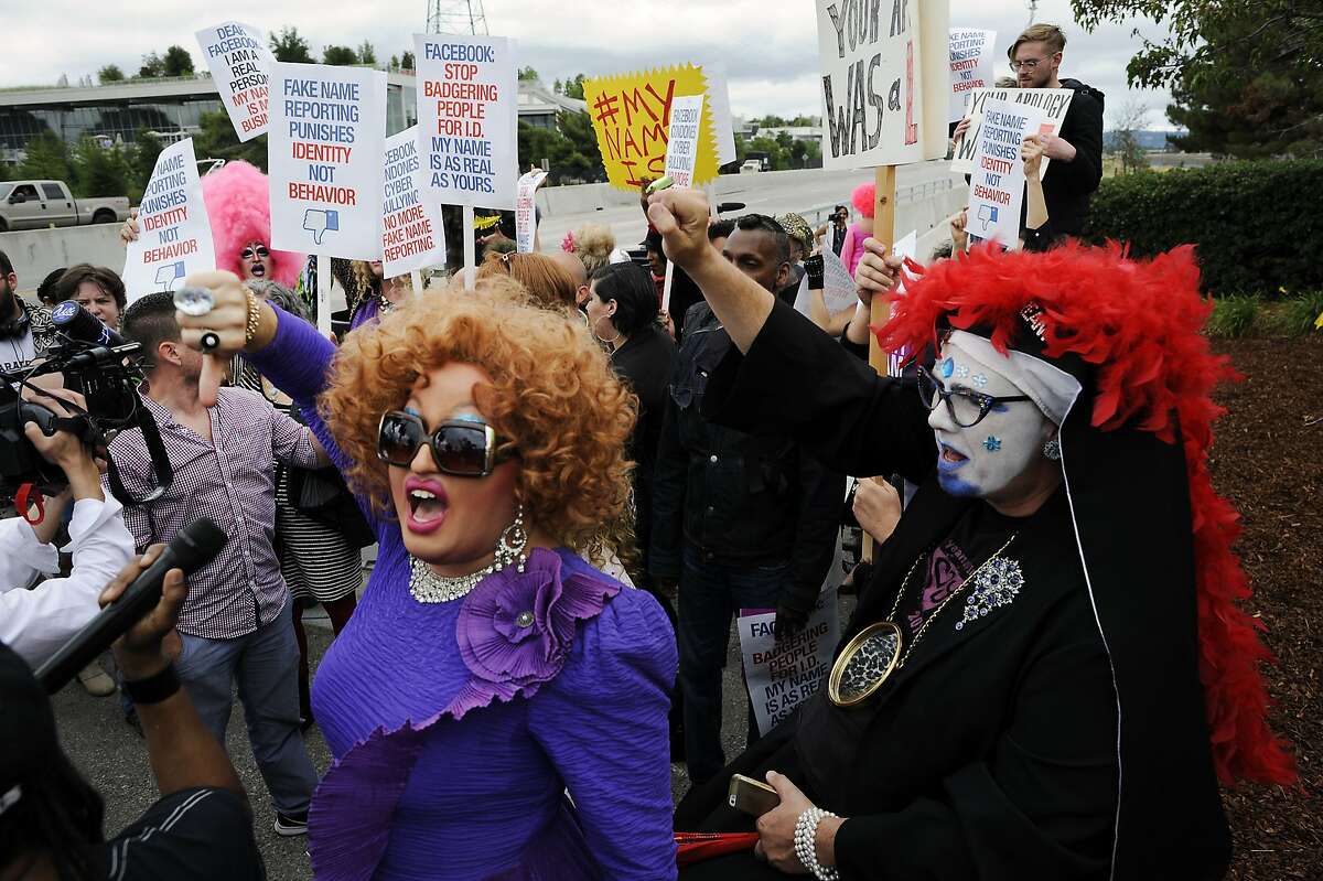 Little Miss Hot Mess, left, and Sister Merry Peter yell as they join other members of the #MyNameIs Coalition in protest Facebook's so-called "fake name policy" in front of their headquarters in Menlo Park, CA Monday, June 1, 2015.