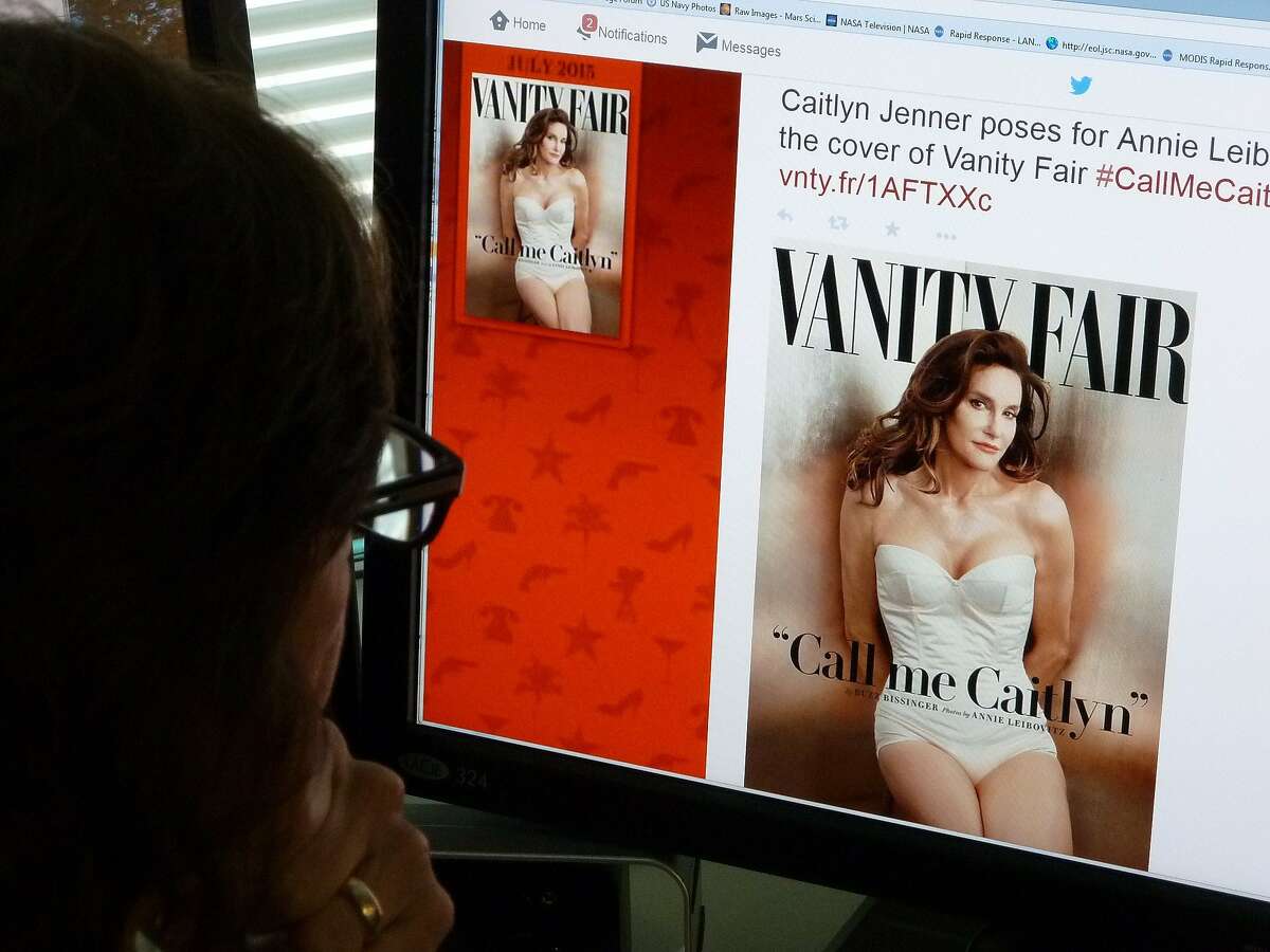 In this June 1, 2015 photo, a journalist looks at Vanity Fair's Twitter site with the Tweet about Caitlyn Jenner, who will be featured on the July cover of the magazine. Caitlyn Jenner, the transgender Olympic champion formerly known as Bruce, on Monday unveiled her new name and look in a sexy Vanity Fair cover shoot -- drawing widespread praise, including from the White House. Lesbian, gay, bisexual and transgender campaigners -- and many well-wishers -- welcomed the high-profile debut, as did the 65-year-old Jenner's family, which includes the media-savvy celebrity Kardashian clan. "I'm so happy after such a long struggle to be living my true self," Jenner wrote in her first tweet after the magazine released the July cover photo by renowned photographer Annie Leibovitz. AFP PHOTO / MLADEN ANTONOVMLADEN ANTONOV/AFP/Getty Images