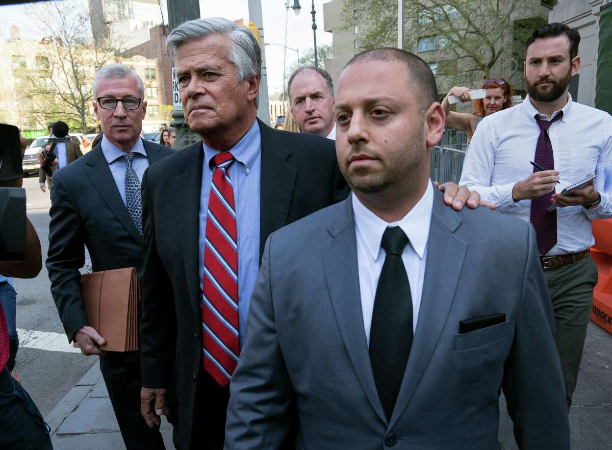 New York Senate Majority Leader Dean Skelos and his son Adam leave federal court in New York, Monday, May 4, 2015, after arraignment on charges including extortion and soliciting bribes amid a federal investigation into the awarding of a $12 million contract. (AP Photo/Craig Ruttle)