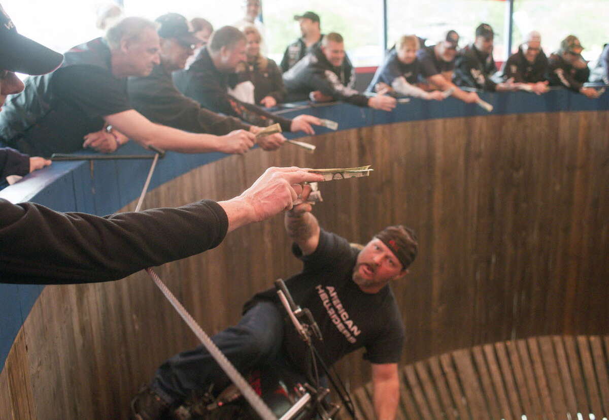 Patch McGillicutty rides his motorcycle in the Wall of Death stunt ring at the Americade motorcycle rally Friday, June 6, 2014, in Lake George, N.Y. Americade draws over 100,000 people to the area annually. 