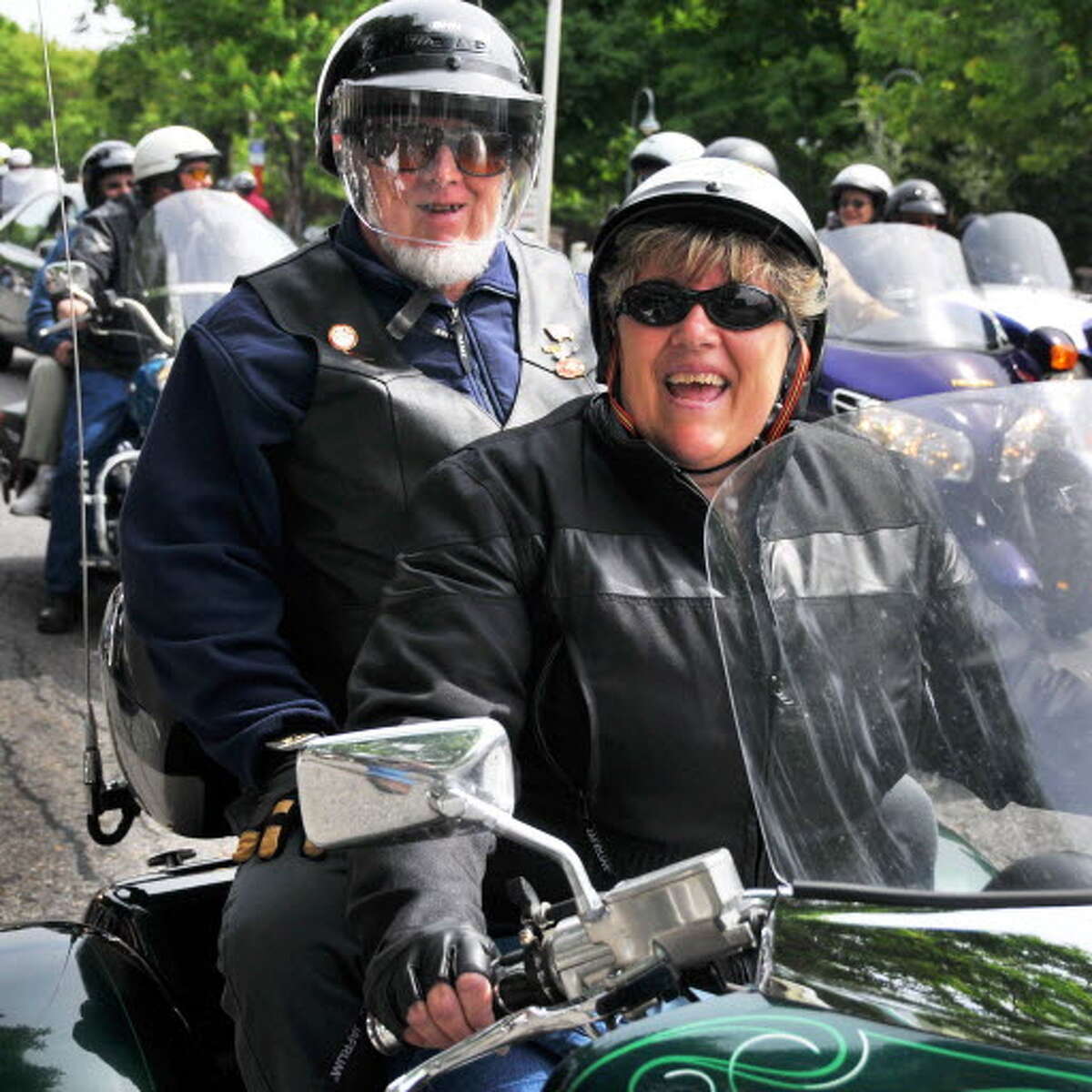 Darrel Palmer,left, rides passenger on his daughter's, Kathy Paradise's, Valkyrie motorcycle as they cruise along Canada Street during Americade weekend in Lake George Friday morning June 5, 2009. 