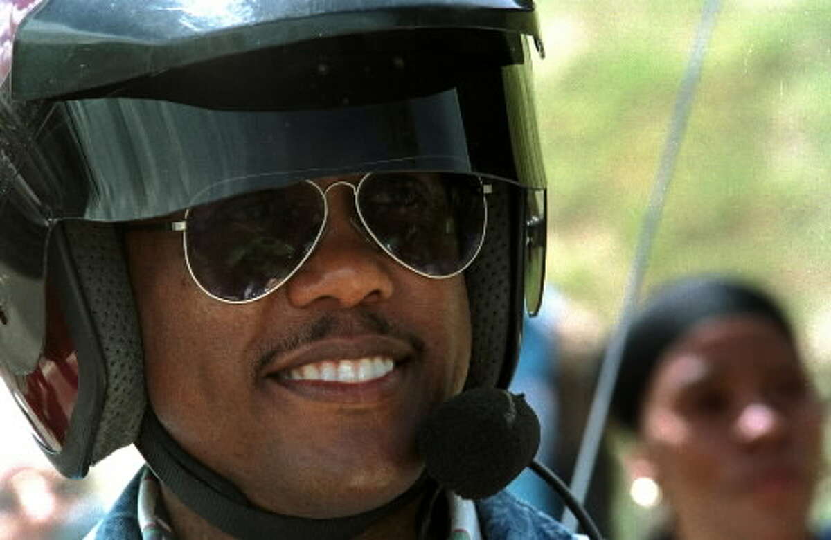 Clive Williams from North Virgina wears a helmet with a mic for comunication with passengeers on his motorcycle during Americade 2001 in Lake George , N.Y. Wednesday June 6, 2001.