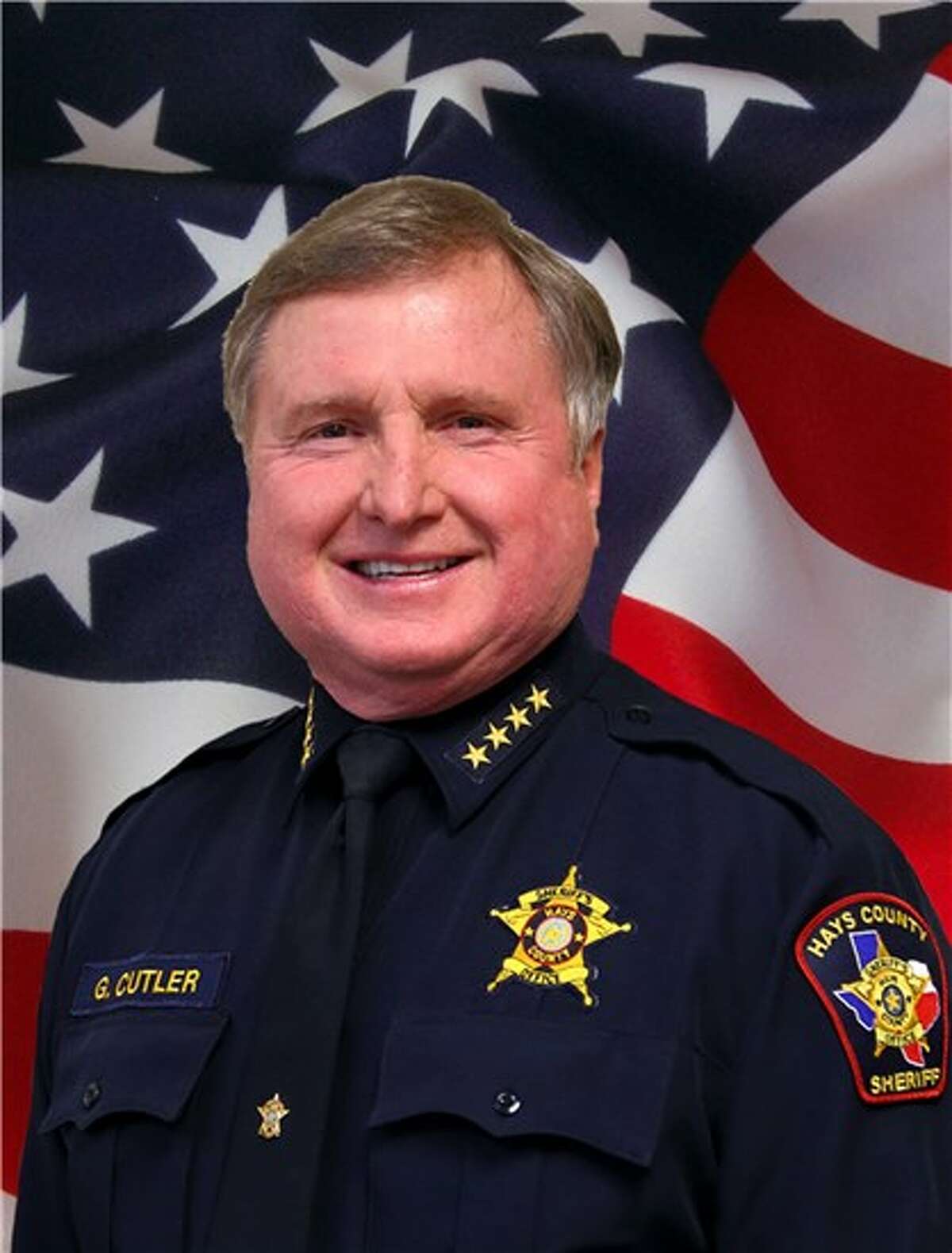Hays County Sheriff Gary Cutler boarded a flight to Europe for a one-week vacation on May 23, hours before record floods hit the area, the Hays County Sheriff's Office confirmed Monday. Cutler returned May 30, but critics blasted him for not returning to the storm-ravaged county more quickly.