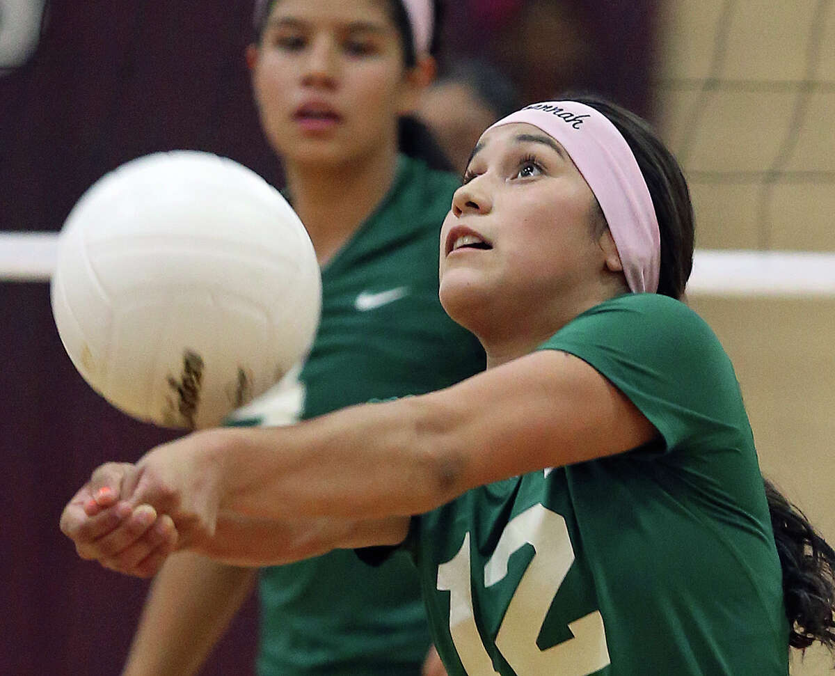 Savannah Borjas saves the ball for the Highland Cowboys in a game against McCollum in the Highlands gym in October.
