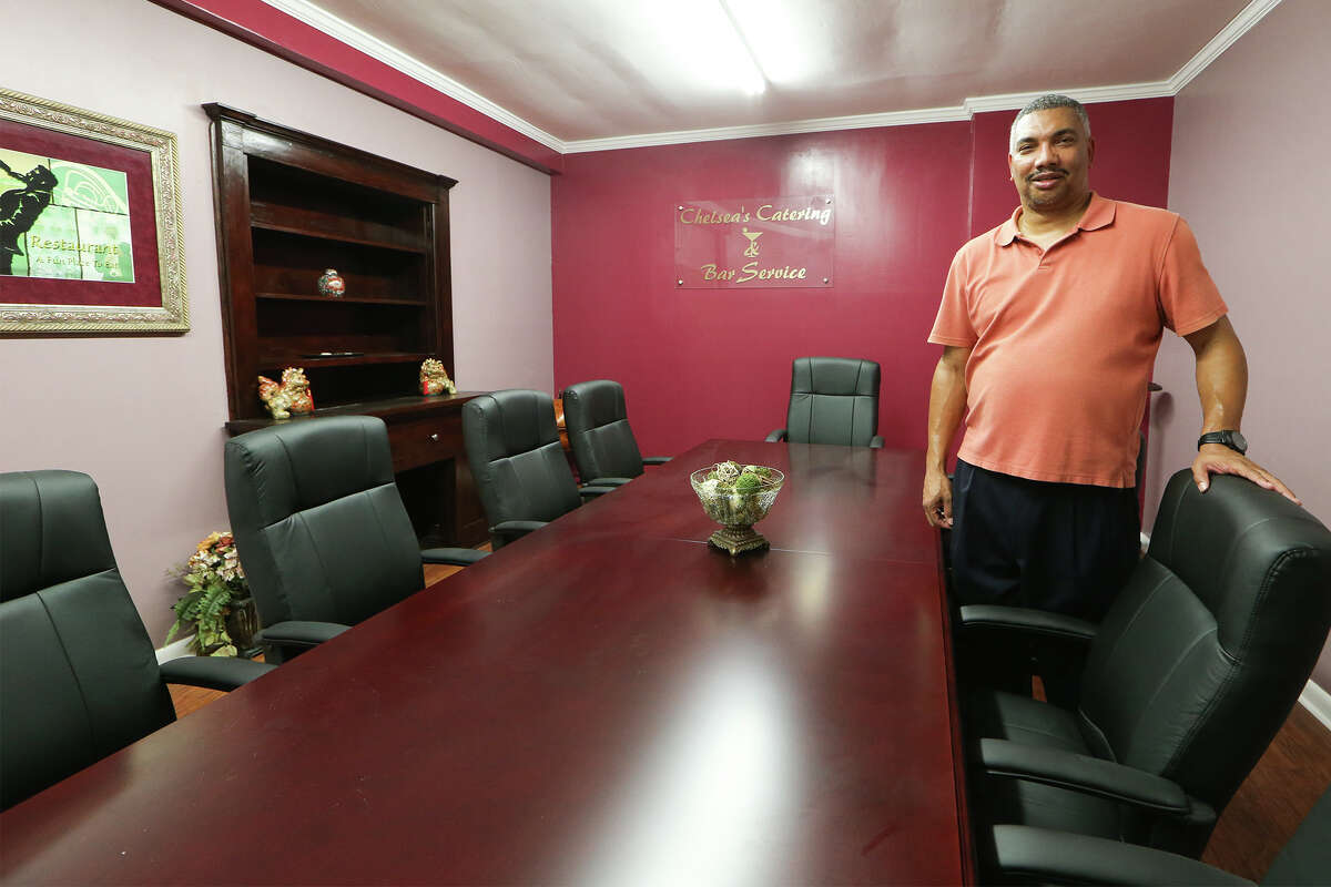 Tony Gradney, owner of Chelsea's Catering & Bar Service. in the conference room at his company's new office at 217 Cactus on Wednesday, May 27, 2015. Gradney obtained funds to renovate the building, which had been vacant for twenty years, from the SAGE Store-Front Grant Program. MARVIN PFEIFFER/ mpfeiffer@express-news.net