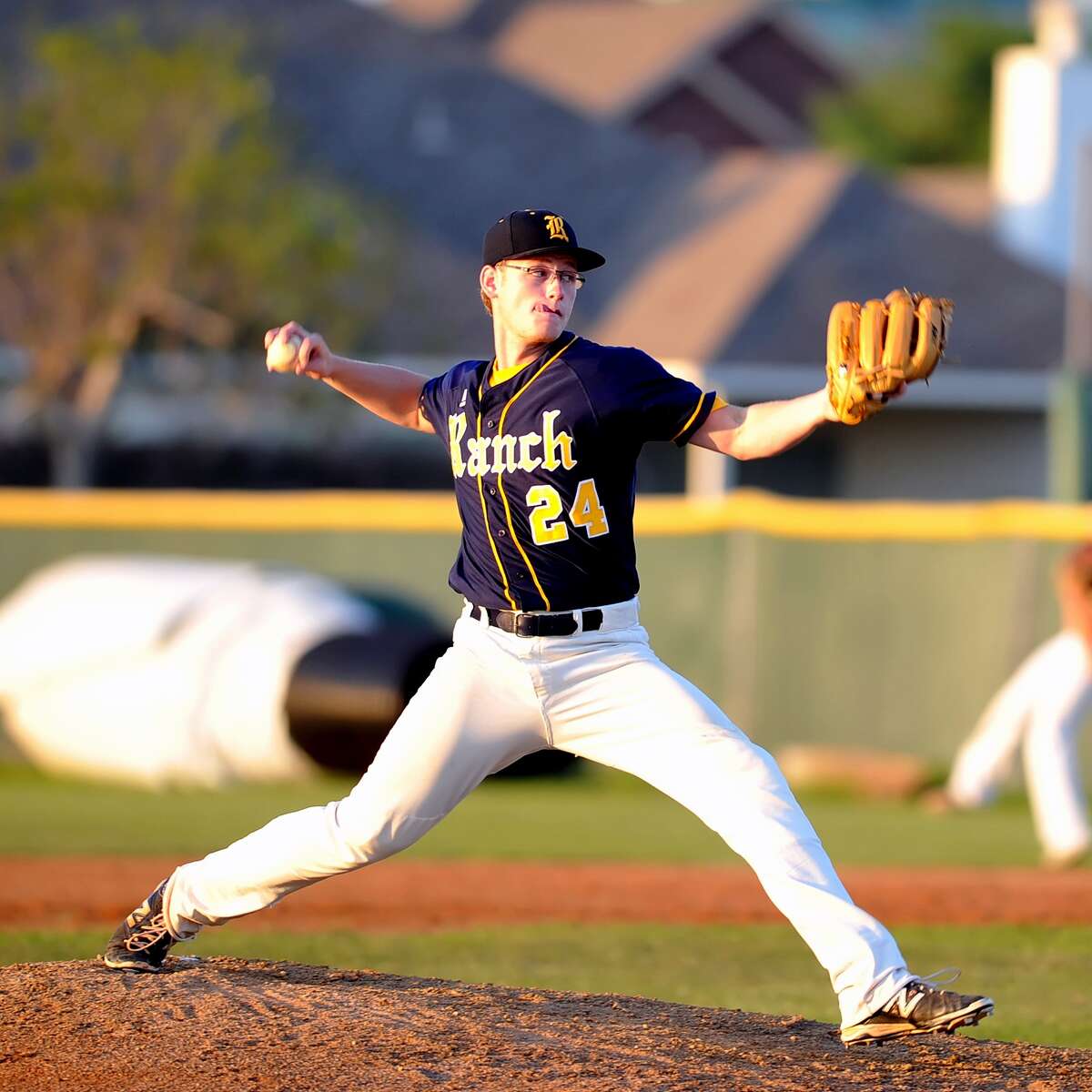 Cy Ranch traveled to Cy Falls for a UIL District 17-6A baseball game. Starting pitcher for Cy Ranch is Riley Gossett, (24).