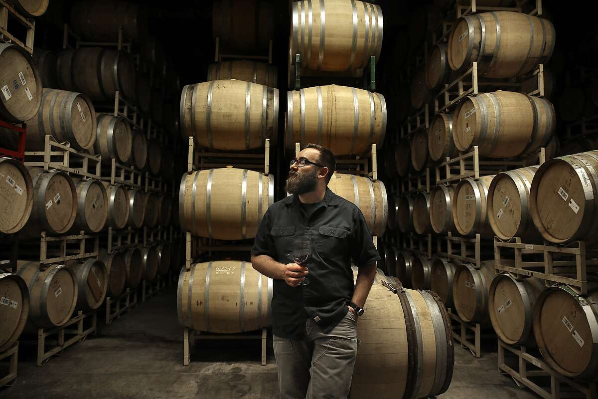 Michael Cruse tastes vin clair in the barrel room at Cruse Wine Co. in Petaluma, California, on Monday, June 1, 2015.