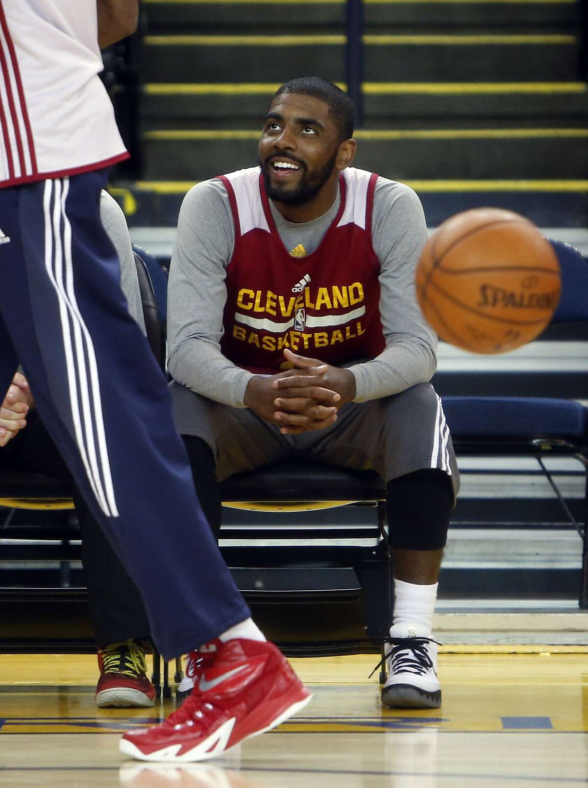Cleveland Cavaliers' Kyrie Irving watches practice at Oracle Arena in Oakland, Calif., on Wednesday, June 3, 2015.