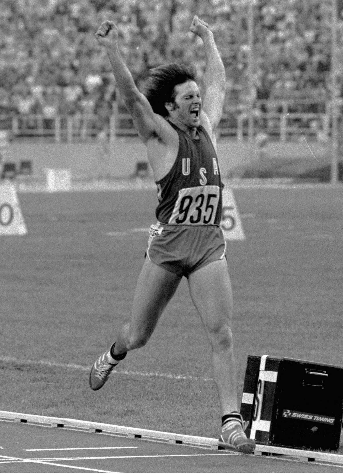 FILe- In this July 30, 1976, file photo, Bruce Jenner , of the United States, leaps in the air as he crosses the finish line in the 1,500-meter race to secure the gold medal in the decathlon at the Olympics in Montreal, Canada. Jenner made his debut as a transgender woman on the cover for the July 2015 issue of Vanity Fair. (AP Photo/File)