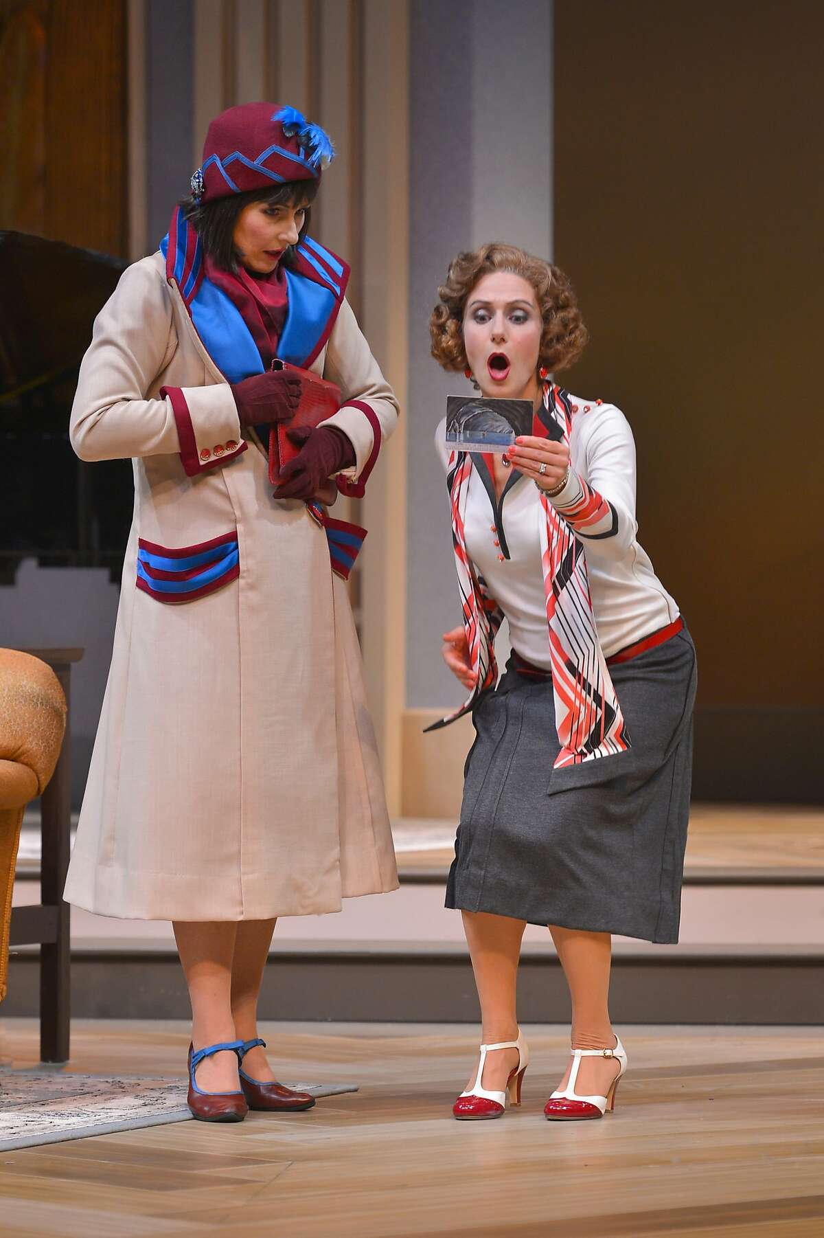 Disaffected wives Jane (Rebecca Dines, left) and Julia (Sarah Overman) receive a postcard from former mutual lover Maurice while their husbands are out of town in "Fallen Angels" at TheatreWorks