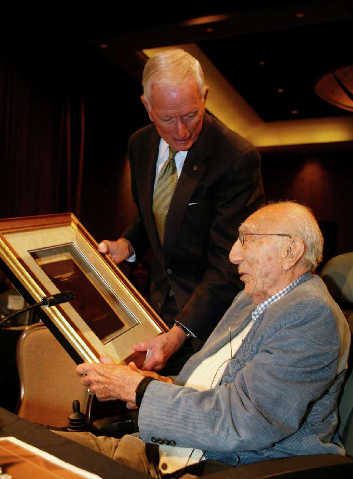 In 2008, Dr. Michael DeBakey, seated, and Dr. Denton Cooley publicly put to rest the private feud.