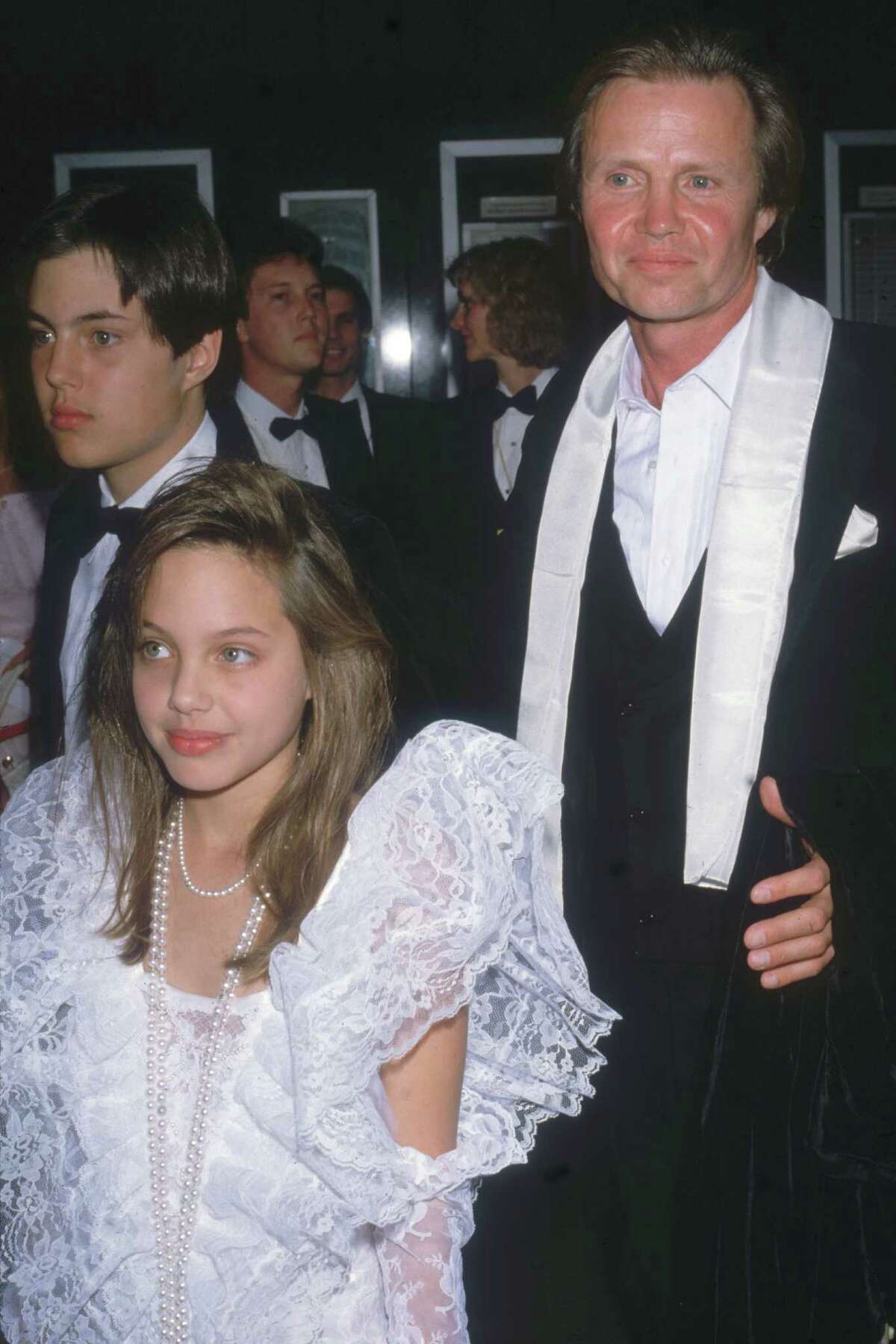 Jon Voight attends the Academy Awards with his son James Haven Voight (left) and daughter Angelina Jolie Voight, then 10 years old, in Los Angeles, March 24, 1986.