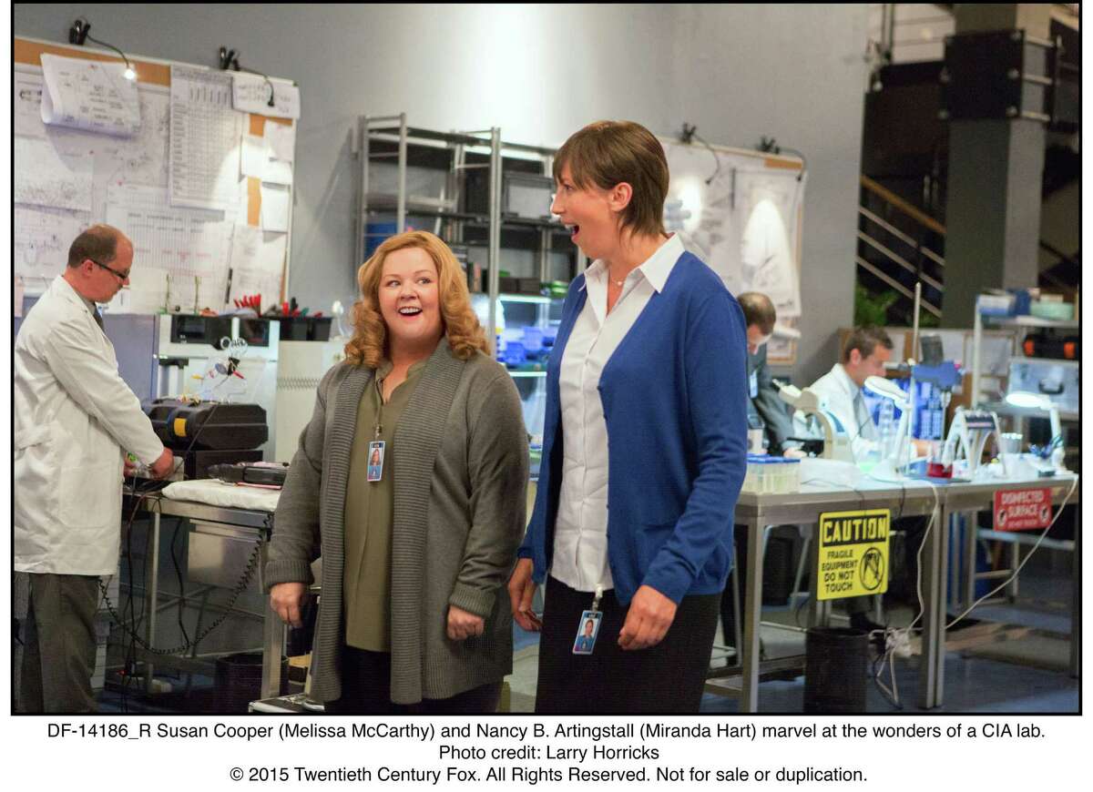 Susan Cooper (Melissa McCarthy) and Nancy B. Artingstall (Miranda Hart) marvel at the wonders of a CIA lab.