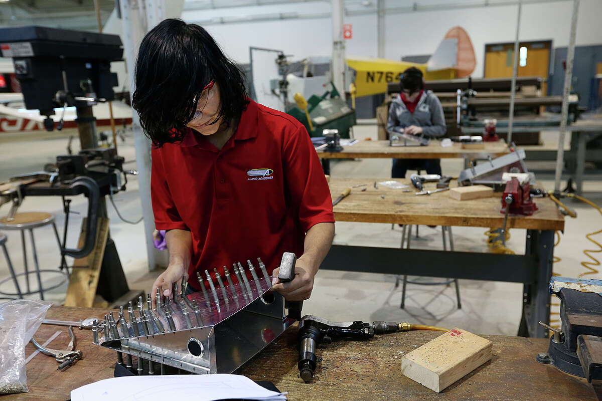 Michael Ramos, 17, works on a part of an airplane wing during a class at the Alamo Academies for IT and aerospace engineering training, Thursday, April 30, 2015. The class is part of Alamo CollegesÍ Workforce Center for Excellence and is located at St. Philip's College campus on Quintana Road. The program won a national Bellwether Award for innovative community college programs. Ramos is a senior at Lanier High School.