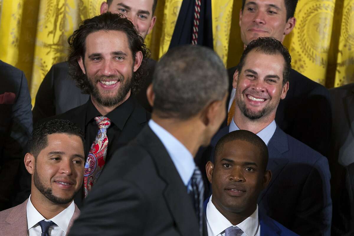 San Francisco Giants pitcher Madison Bumgarner, second from left, and pitcher Ryan Vogelsong, right, laugh as President Barack Obama welcomes the World Series champion Giants, Thursday, June 4, 2015, during a ceremony in the East Room of the White House in Washington. (AP Photo/Evan Vucci)