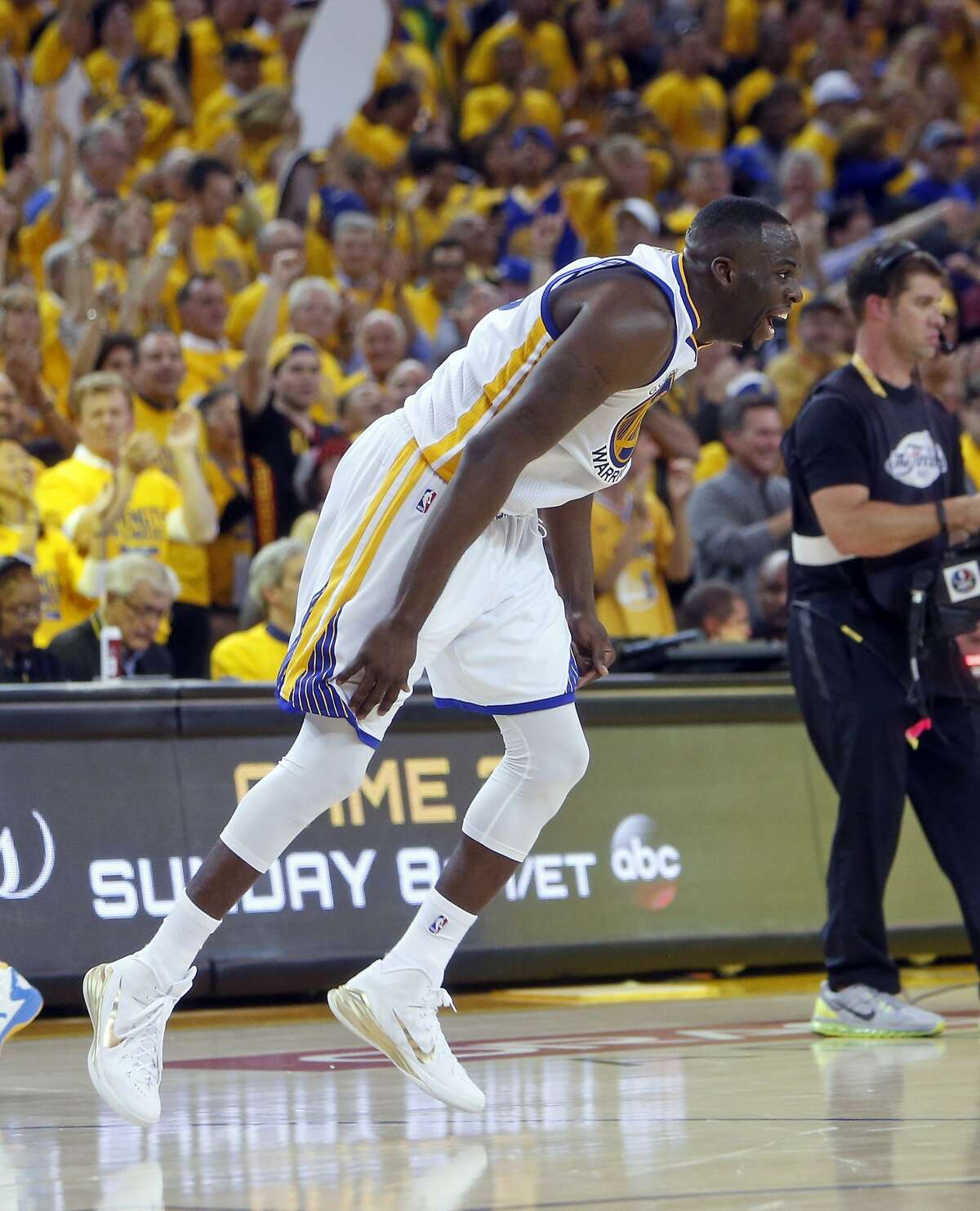 Golden State Warriors' Draymond Green celebrates in overtime of 108-100 win over Cleveland Cavaliers in Game 1 of the 2015 NBA Finals at Oracle Arena in Oakland, Calif., on Thursday, June 4, 2015.