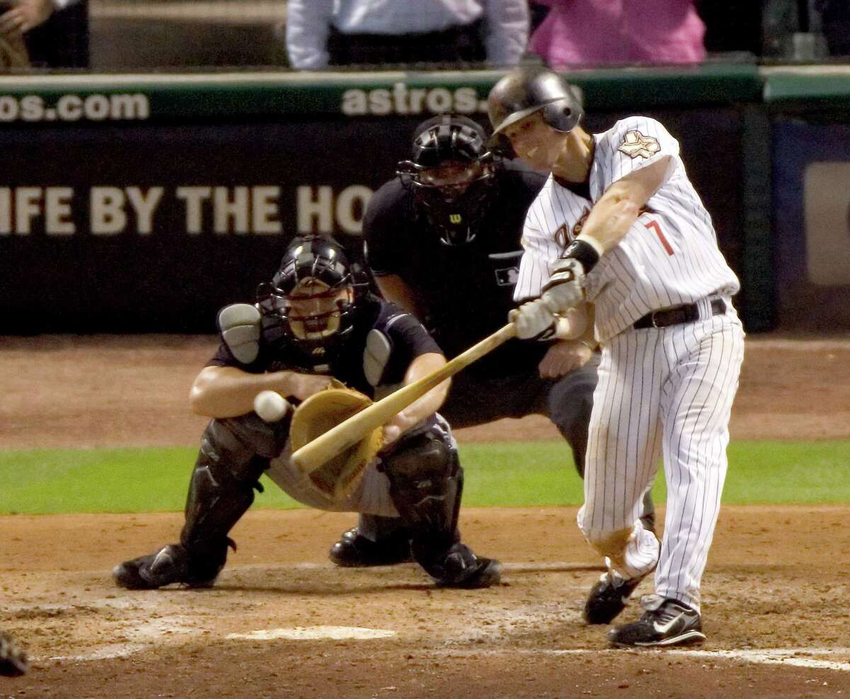 Houston Astros second baseman Craig Biggio (L) celebrates his 3,000 career  hit by hoisting one of his sons in the seventh inning against the Colorado  Rockies at Minute Maid Park in Houston