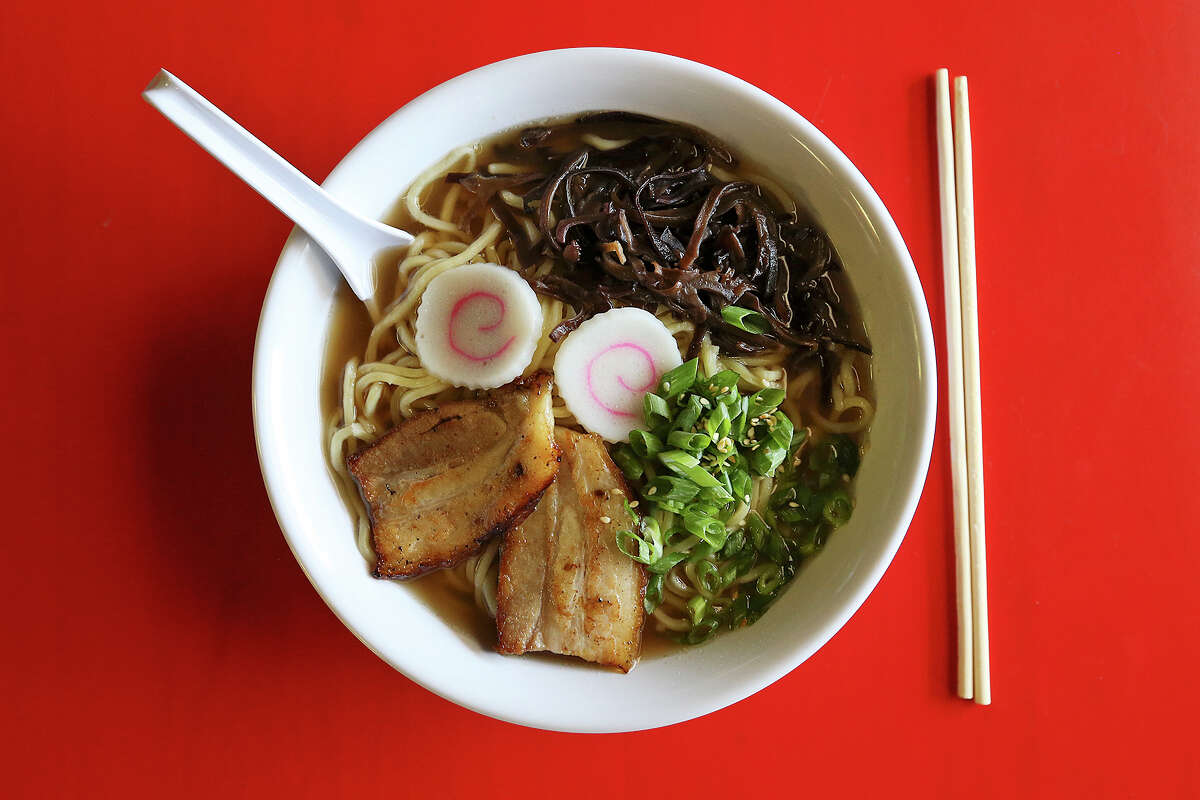 Shoyu ramen features a chicken and soy sauce broth with noodles, sliced pork belly, fish cake slices and wood ear mushrooms.
